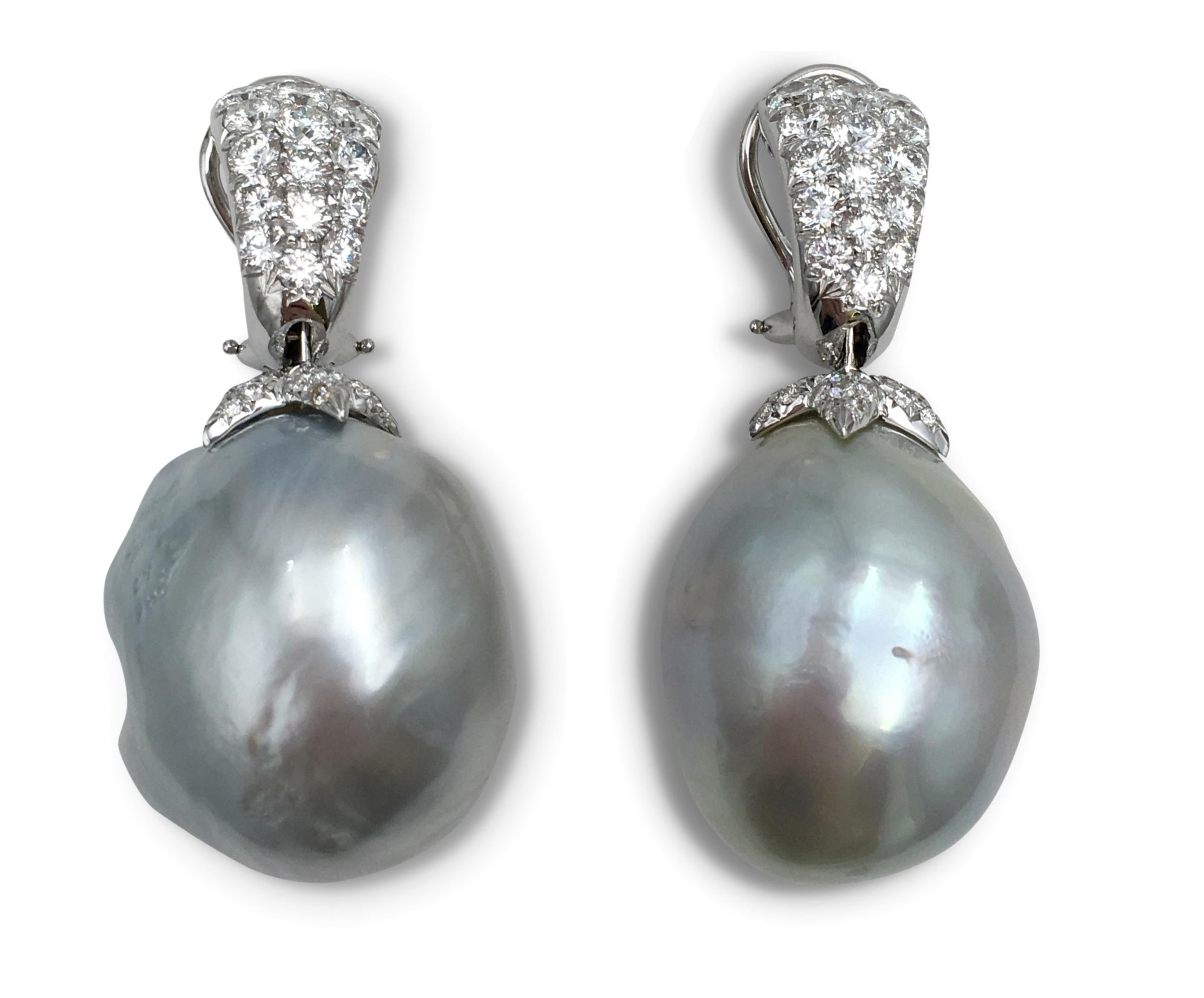 A pair of grey hued baroque pearl drop clip earrings set with approximately 4.45 carats total weight of round brilliant cut diamonds (F color, VS clarity). The pearls measure approximately 24 x 21.3 x 19.1mm. Made in 18 karat white gold. Signed