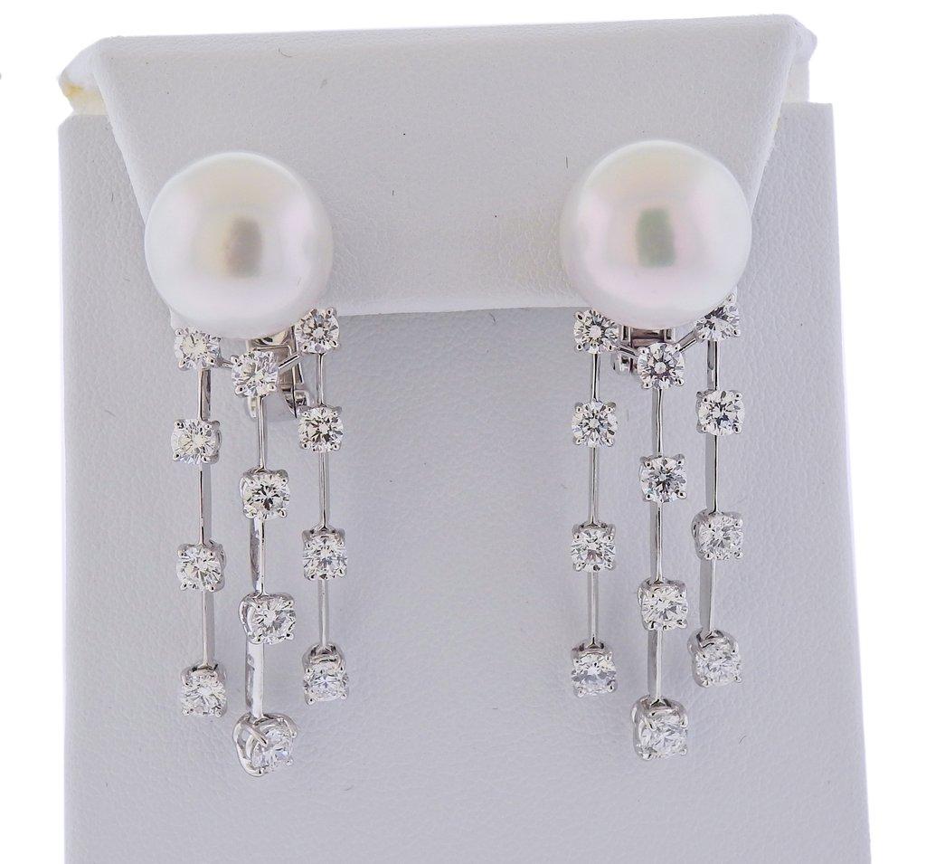 New 18k white gold earrings, by Assael. Set with 3.84ctw VS/G diamonds, and pearls. Earrings are 45mm long, South Sea pearls - 13.7mm. Marked - 750. Weight- 20.7 grams. Retail $22000
