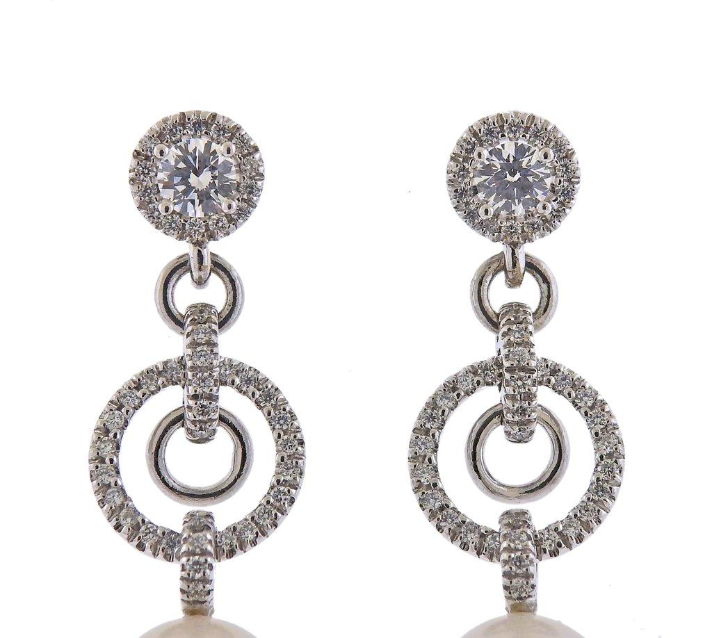 New 18k white gold drop earrings, by Assael. Set with 1.21ctw of VS/G diamonds, and south sea pearls. Earrings are 44mm long. South Sea pearls - 12mm x 14mm. Marked - 750. Weight - 14.1 grams. Retail $13000
