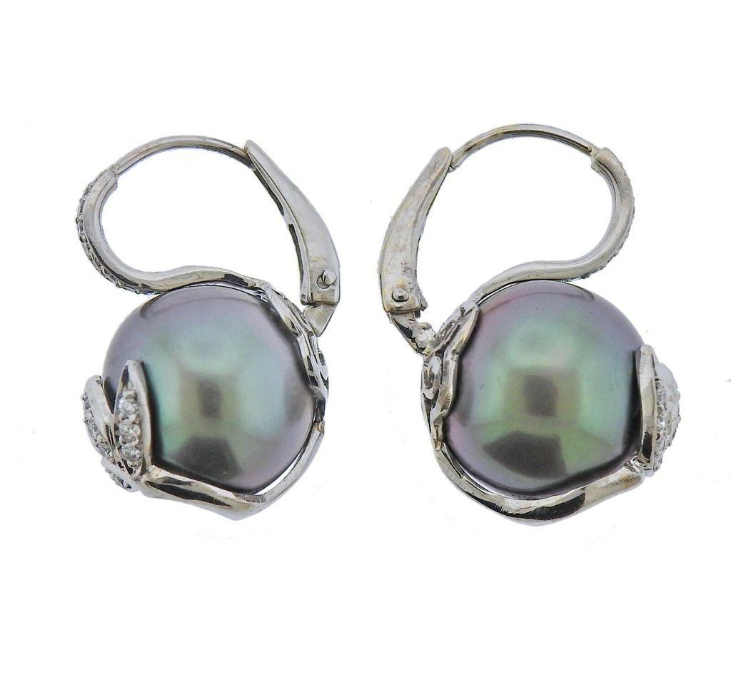 New 18k white gold earrings, by Assael. Set with 0.25ctw VS/G diamonds. Earrings are 24mm long, South Sea Tahitian pearls - 13.2mm. marked - 750, Assael. Weight 10.7 grams. Retail $4800
