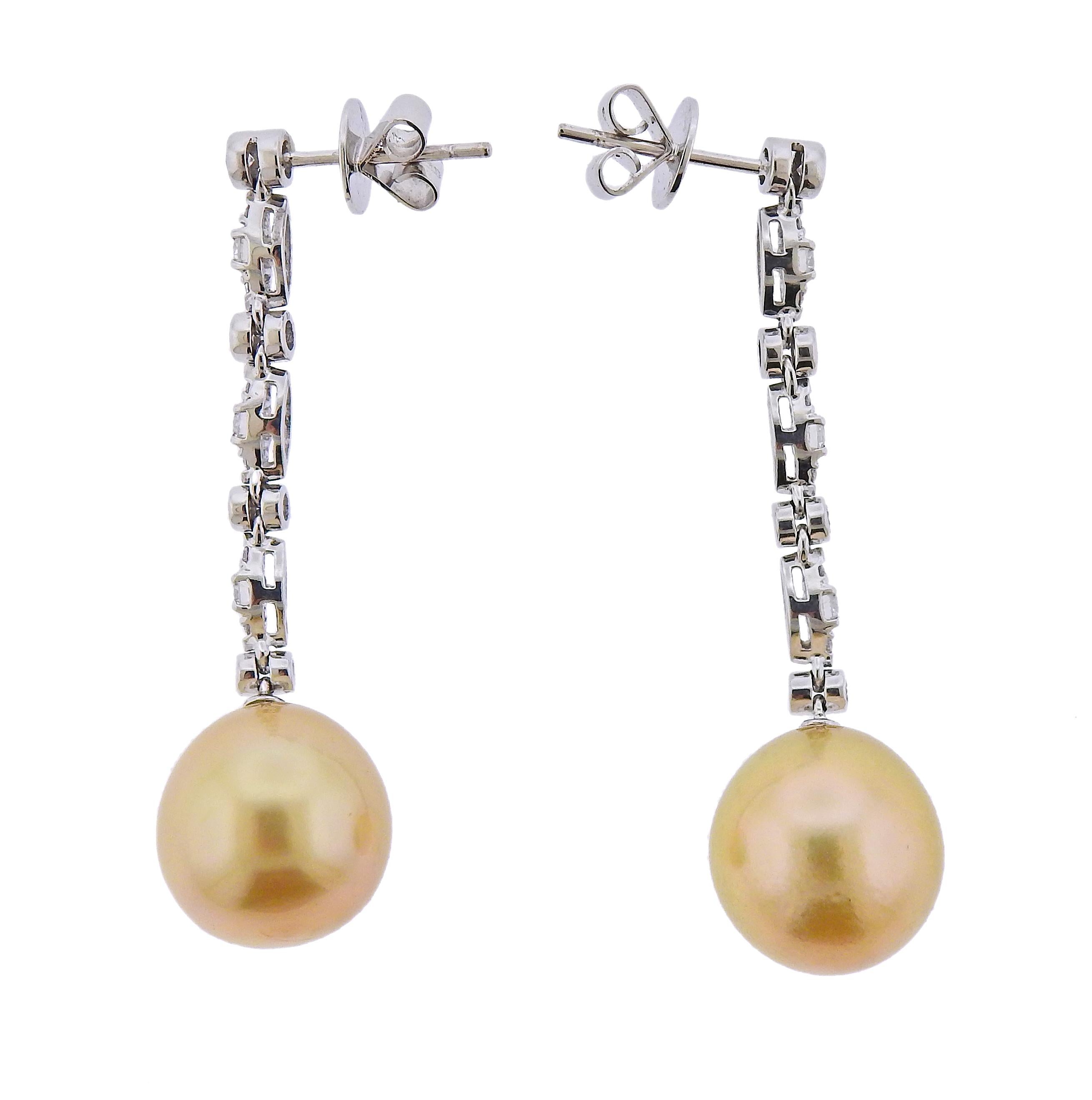 Pair of new Assael long drop earrings in 18k gold, with approx. 0.83ctw in G/VS diamonds and 13mm Golden South Sea Pearls.  Retail $8900. Come with pouch.  Earrings are 48mm long. Weight - 10.8 grams. Marked: 750, Assael. 
