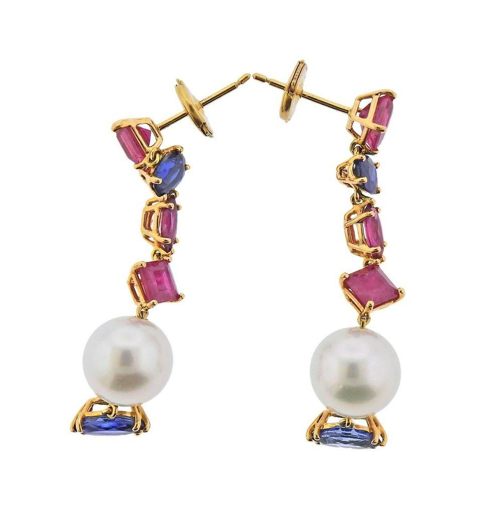 New 18k yellow gold earrings, by Assael. Set with 4.18ctw of rubies, 2.85ctw of sapphires, and pearls. Earrings are 48mm long. Tested - 750. Weight - 8.7 grams. Retail $10400
