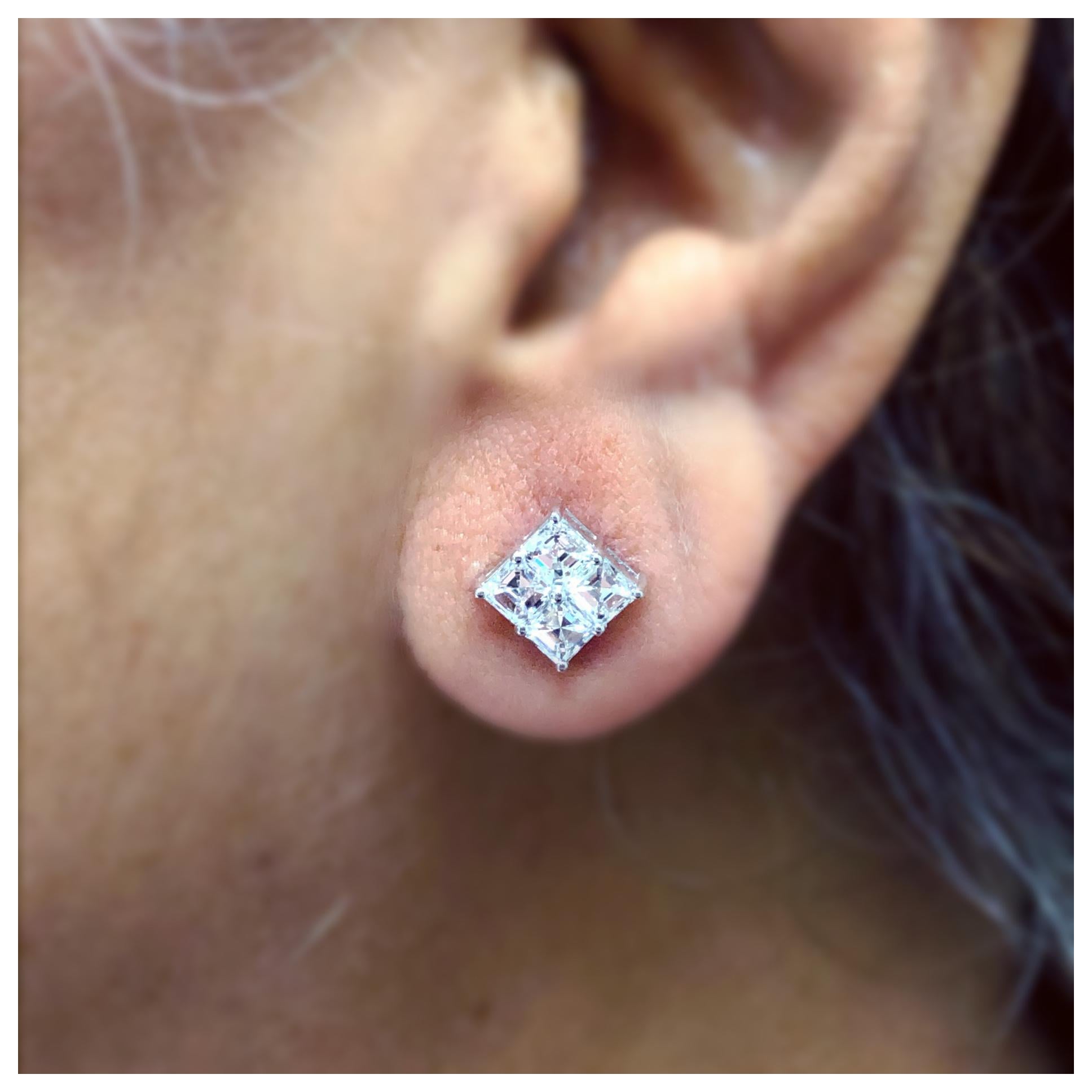 Asscher Cut diamond cluster earrings containing 8 diamonds all F color VS clarity weighing 1.98 ct. total weight in 18kt white gold with screw backs. If you don't see something, say something! We are a custom jewelry manufacturer in the heart of the