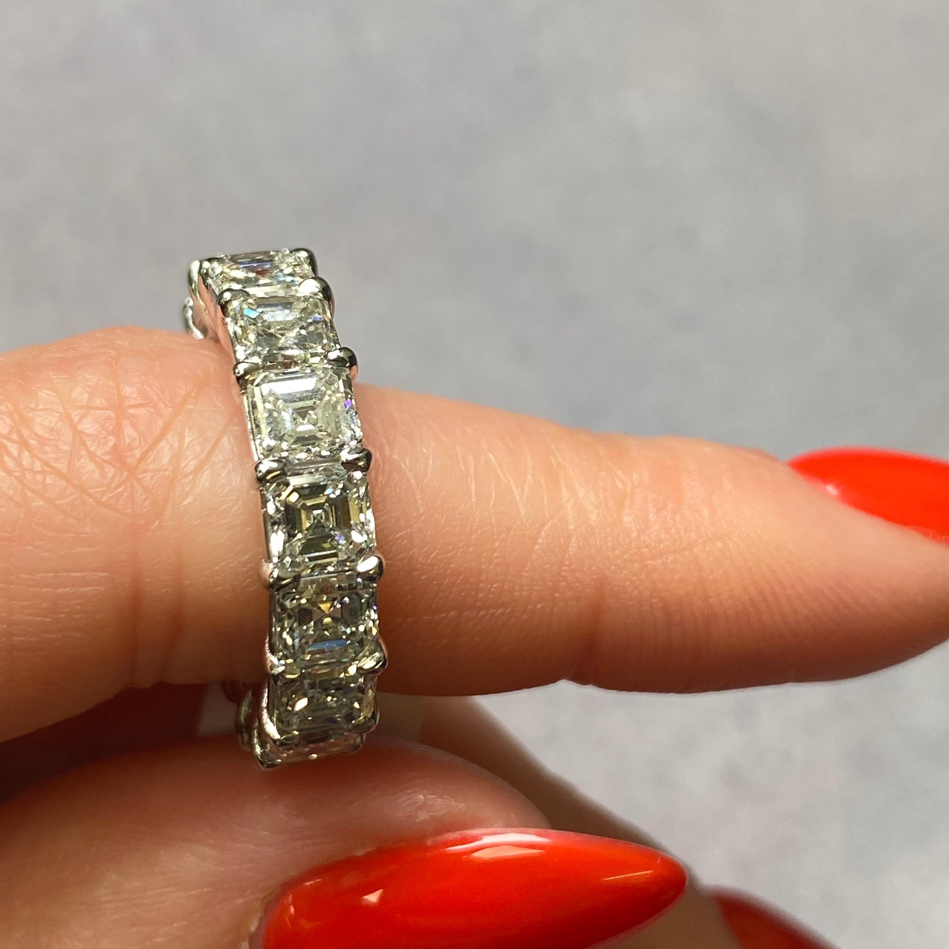 A dazzling circle of 8.13 cttw Asscher-cut diamonds set in stunning platinum eternity ring making it an ideal wedding ring or anniversary gift. Total of 16 beautiful diamonds. Diamond color F and VS clarity. Ring width: 5.60mm. Ring size 6. This