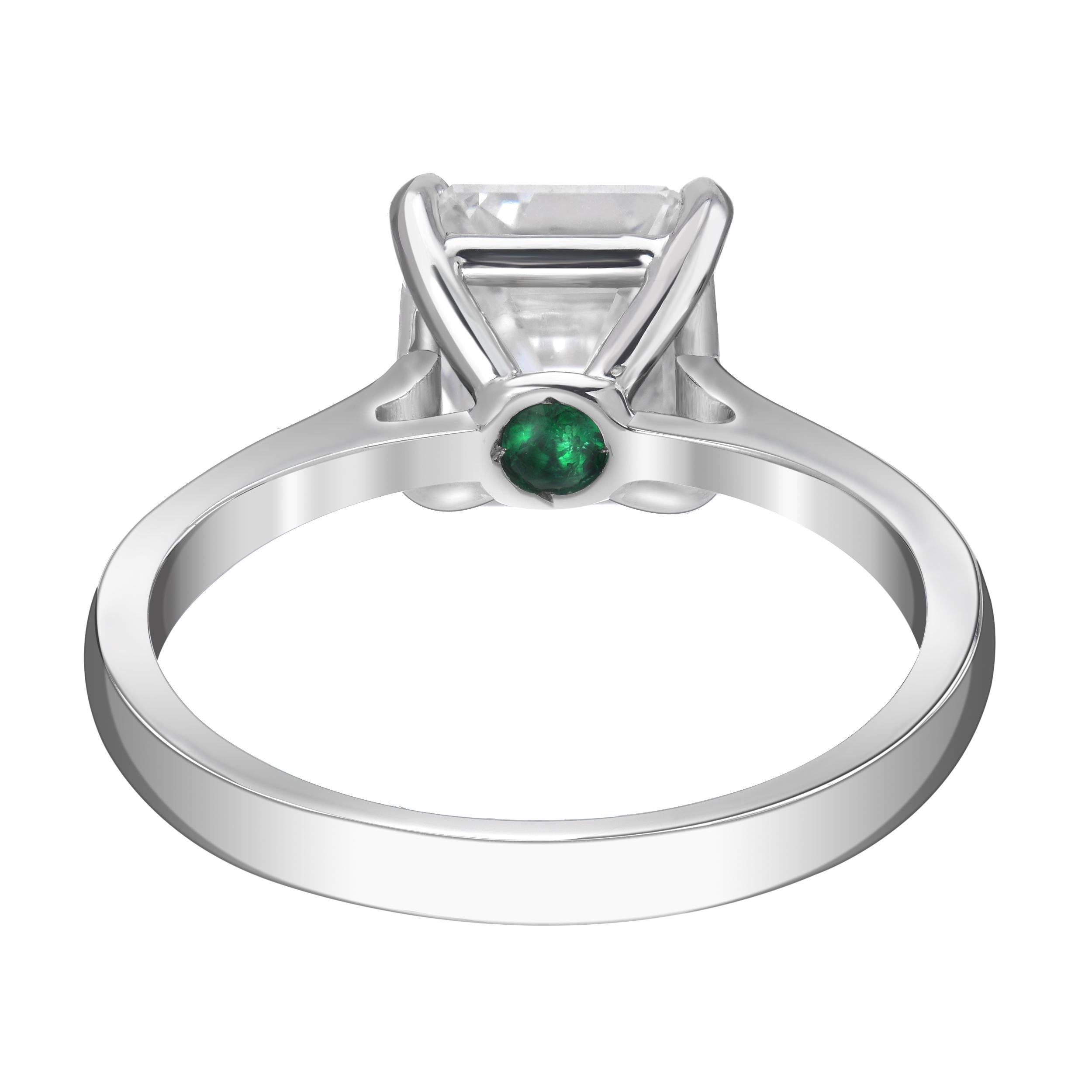 2 carat asscher cut diamond solitaire ring set in platinum with an emerald accent underneath