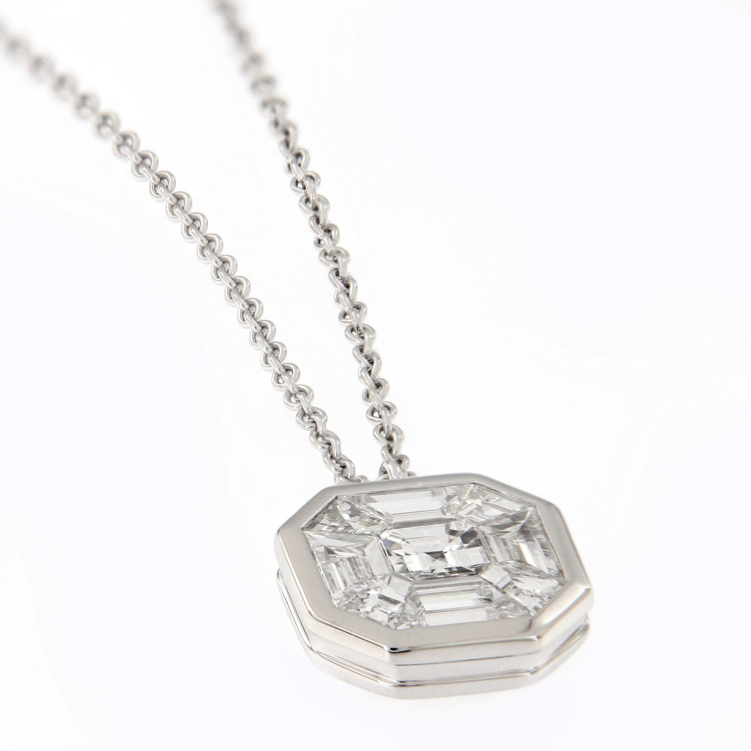 Elegantly fashioned pendant features a 1.05 carat asscher cut diamond, invisiable set in 18k white gold. Pendant hangs from an adjustable 18k white gold chain. The Pendant is 10.6 mm diameter. Weighs 5.2 grams.