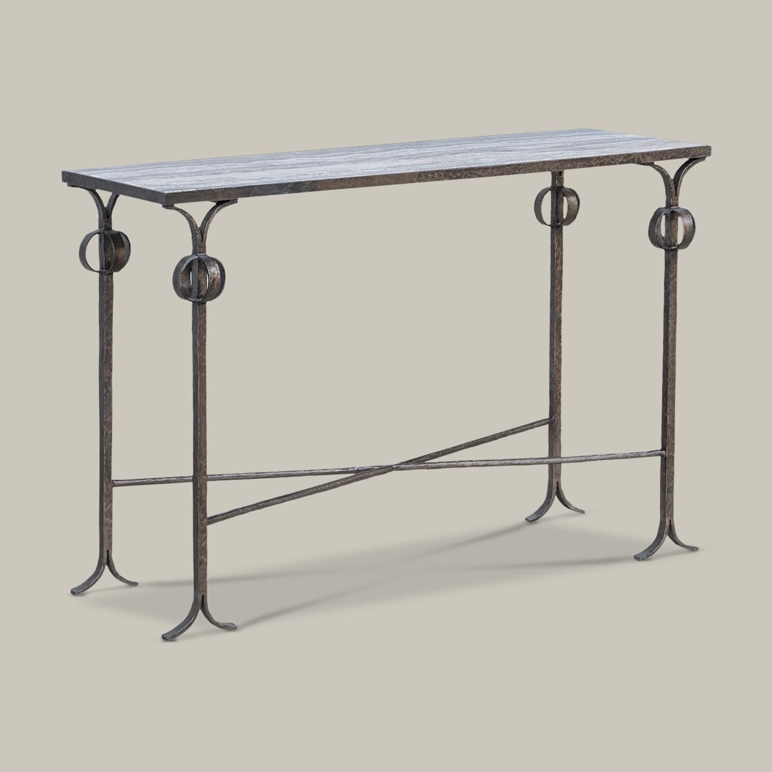 Inspired by the sculptural ironwork of Diego Giacometti, this decorative, functional, modern console table features a natural marble top.
