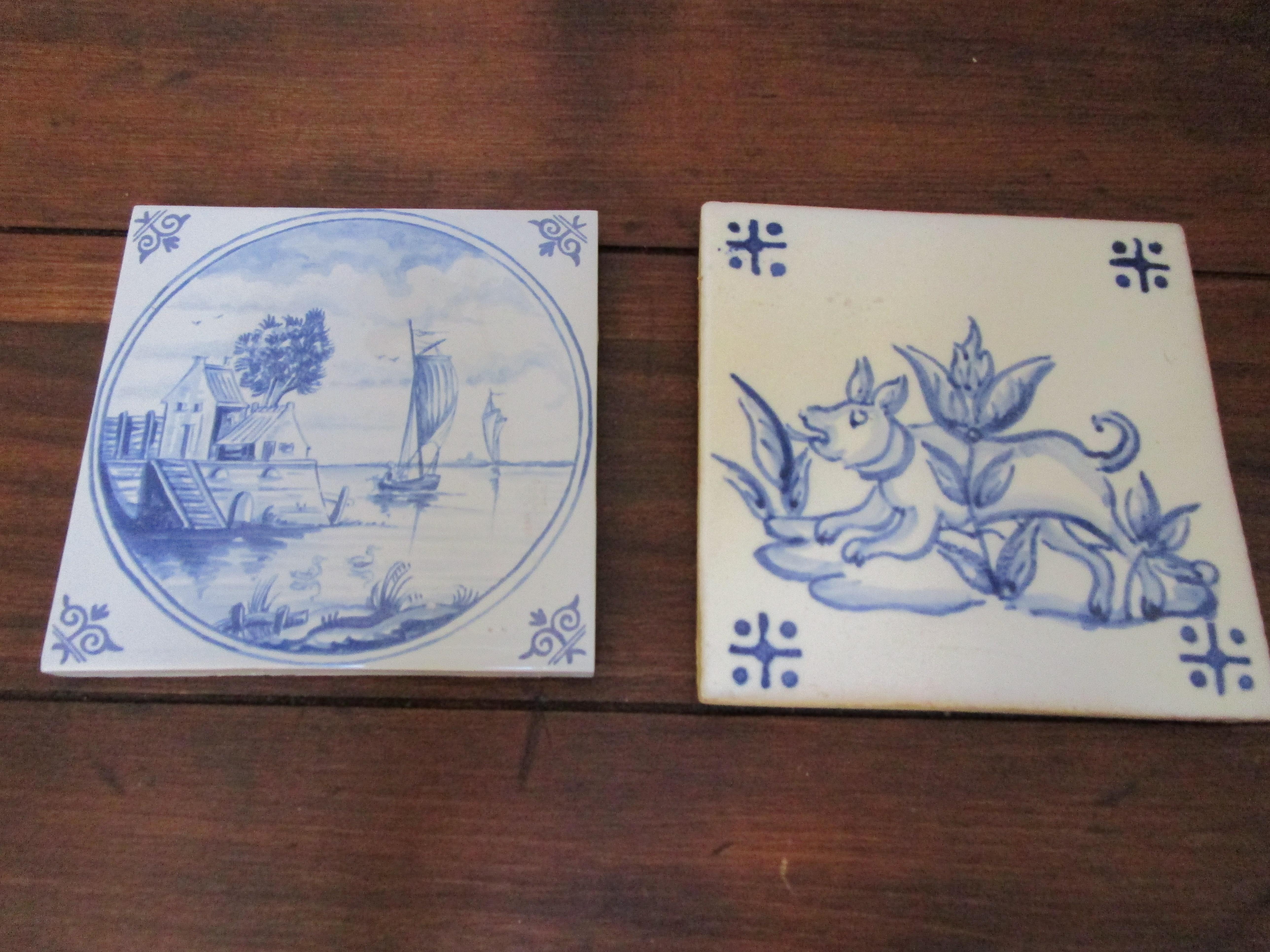 Two assembled Delft tile pieces in blue and white are charming from two different periods. One tile represents a waterscape with detailed drawings. A sailboat is in the middle of the painting and appears to be returning to a dock. There is a small