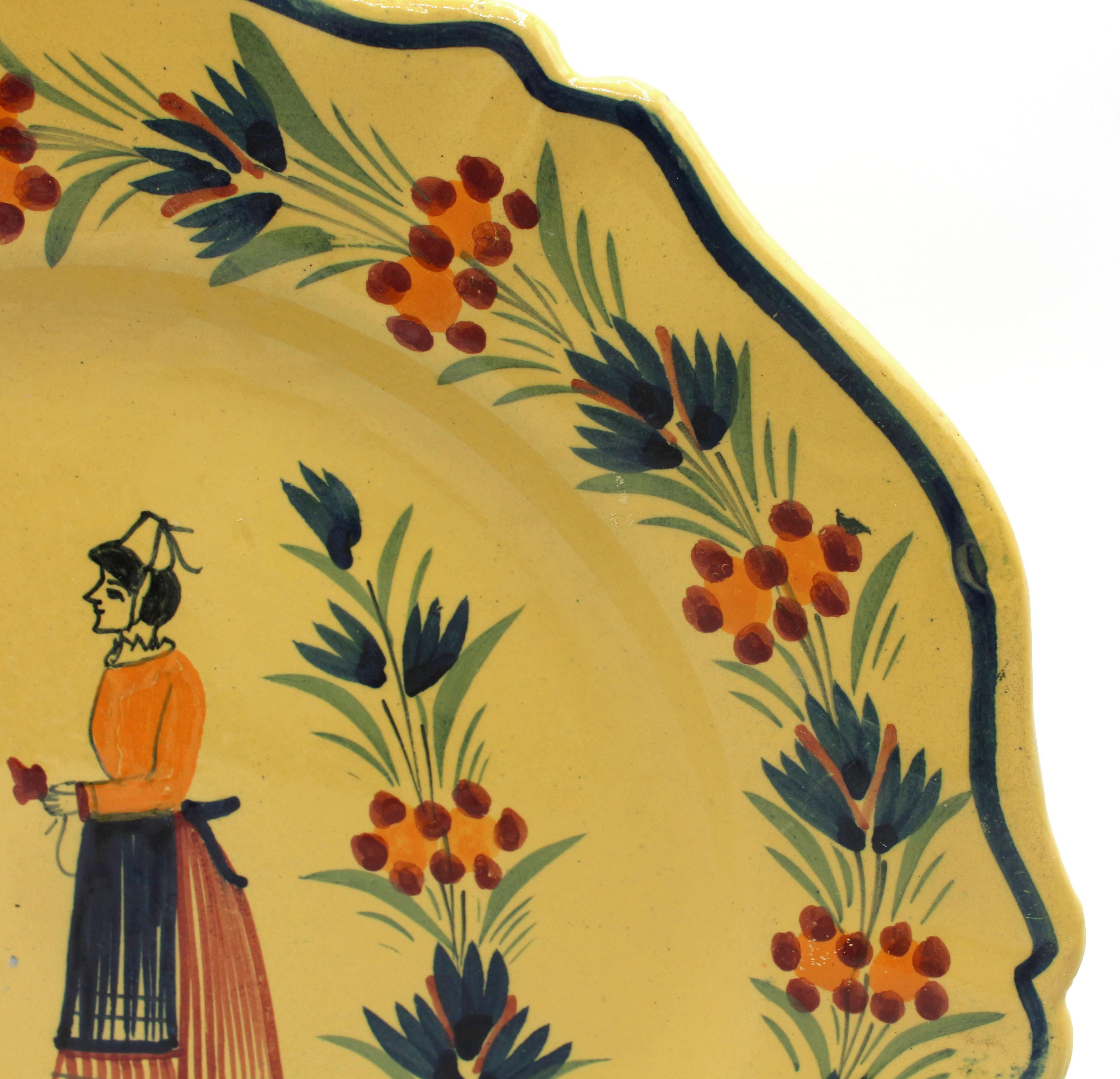 Ceramic Assembled Pair of Large Yellow Ground Quimper Plates, Mid-20th Century For Sale
