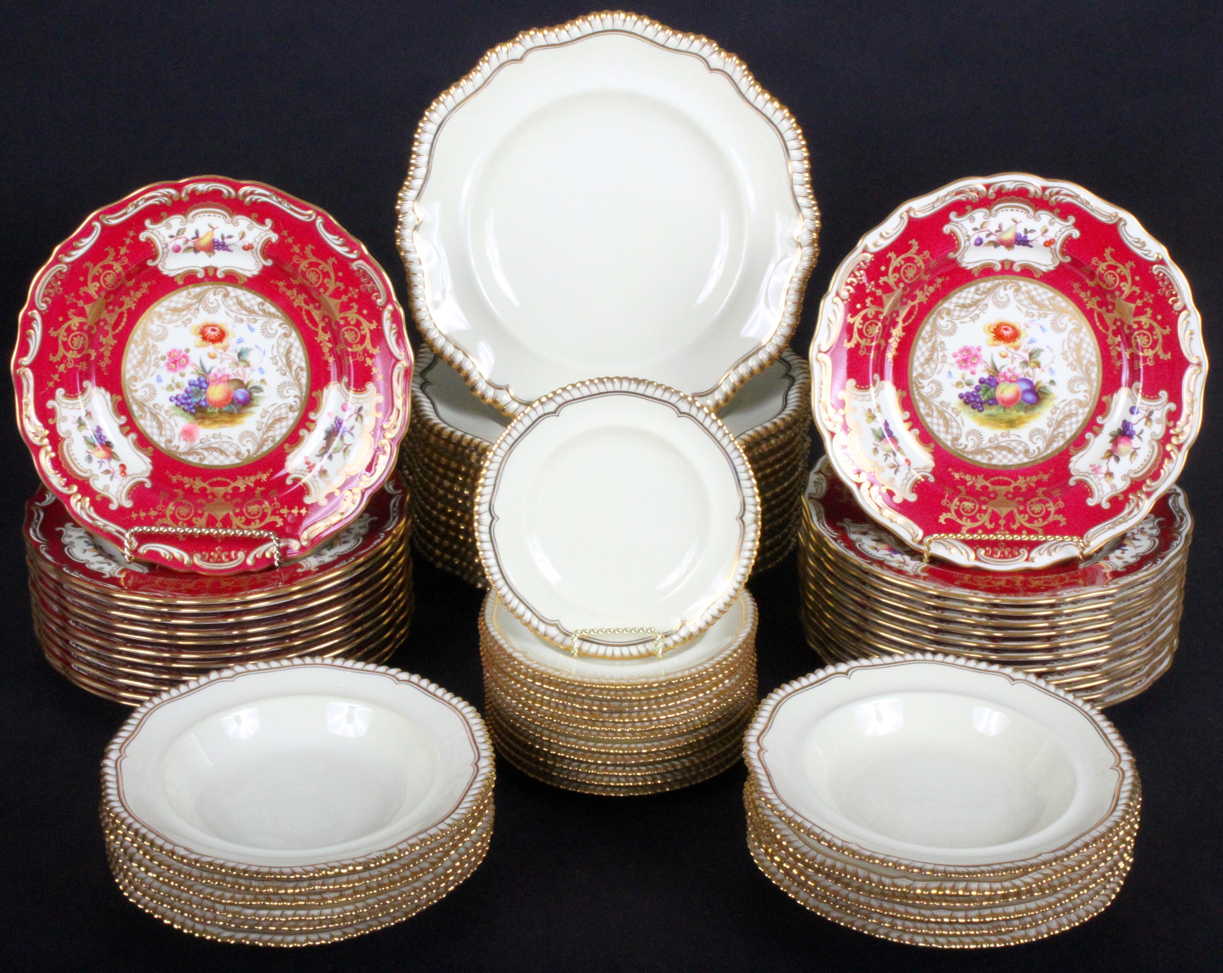This set of Spode-Copeland plates features reproductions of antique styles from the turn of the century. The set contains 12 each of dinner, salad, dessert, bread and soup for 60 pieces in total. The two sets of prominent red plates are Based Upon