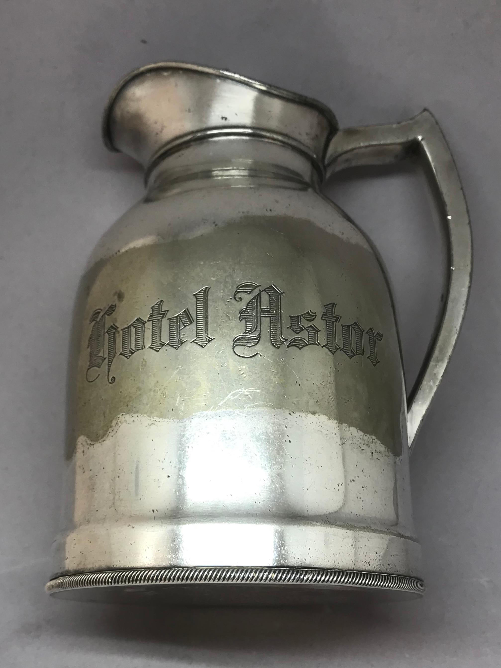 Assembled set of hotel silver serving pieces. Group of plated silver pieces from various New York hotels including an insulated carafe from the Hotel Astor, four candy dishes from the Hotel Dorset, a double handled individual sauce boat from the