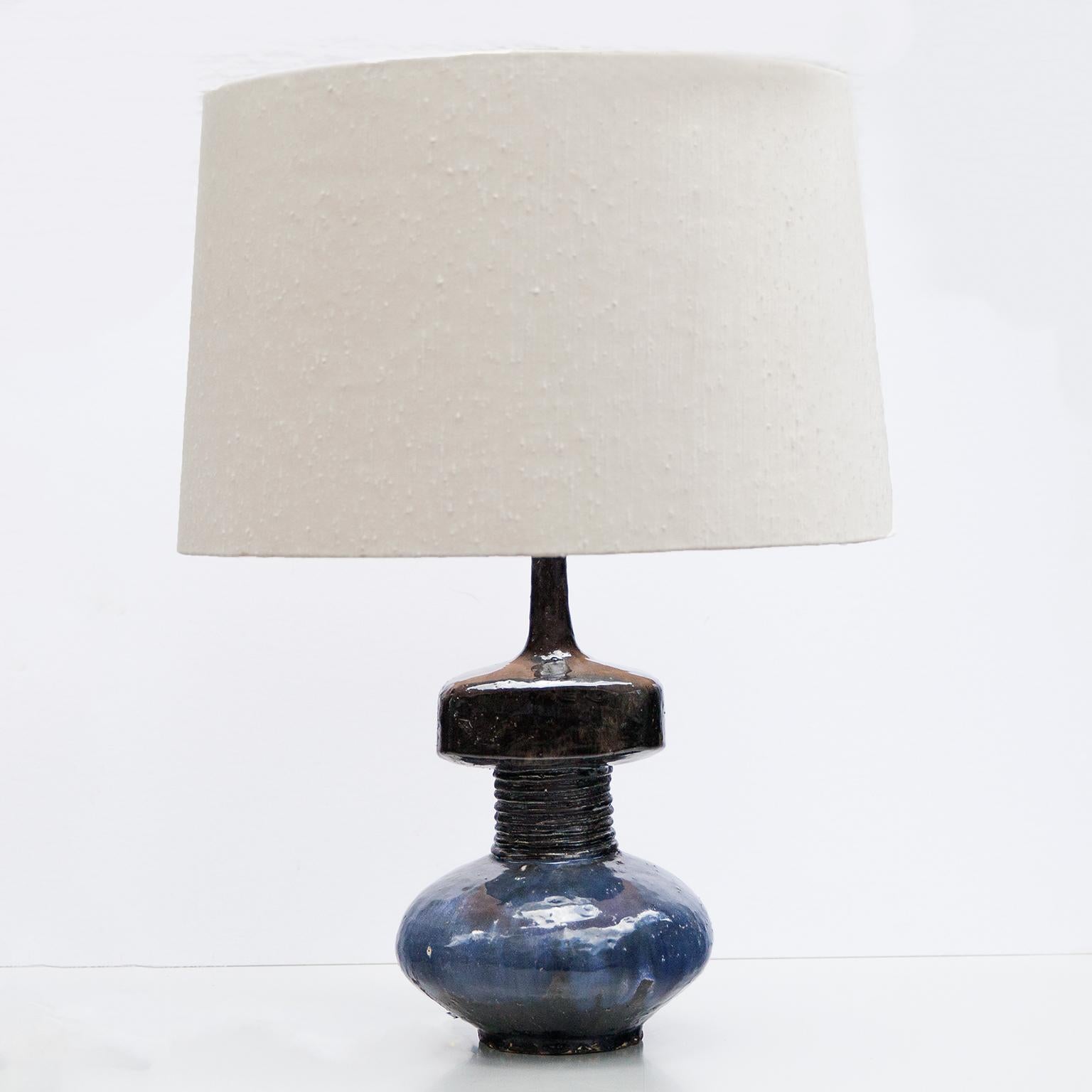 Wonderful organic blue glazed ceramic table lamp with a wild silk shade by Ingeborg und Bruno Asshoff from 1980s.
Marked on the bottom with workshop mark a (embossed stamp).
Literature: Ehrenpreis Deutsche Keramik 1994. Ingeborg und Bruno Asshoff.