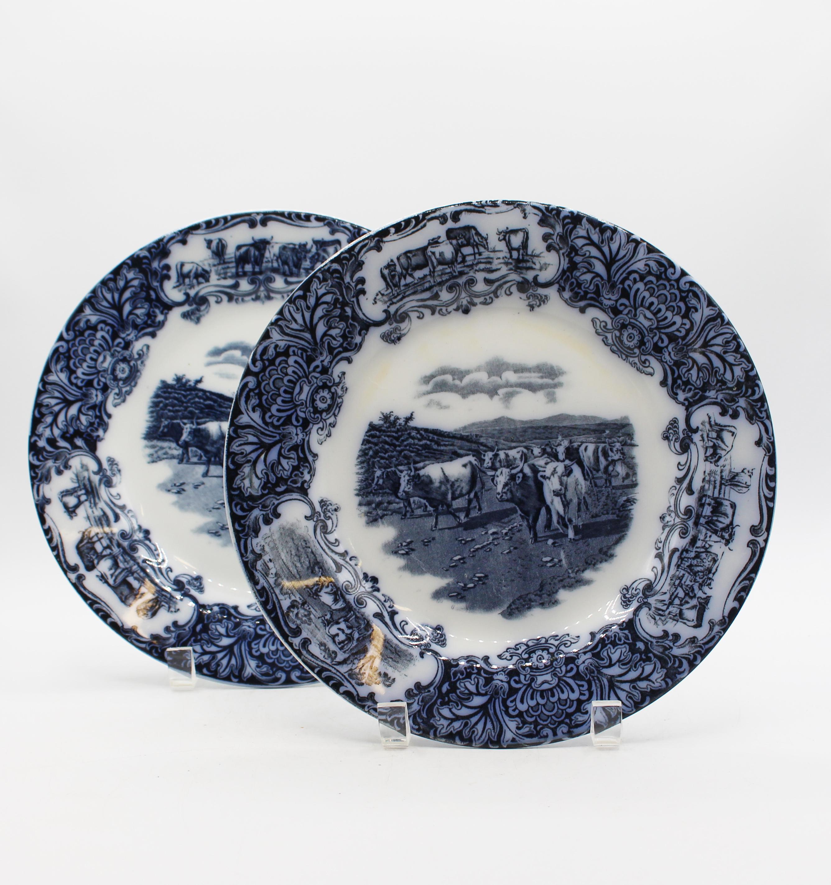 An associated pair of 1906 & 1908 Wedgwood Cows flow blue pattern plates, English. Reserves of Highlands Cattle surrounded by 3 reserves of short horn cattle grazing & resting. Good overall condition, minor knife marks & wear.
10