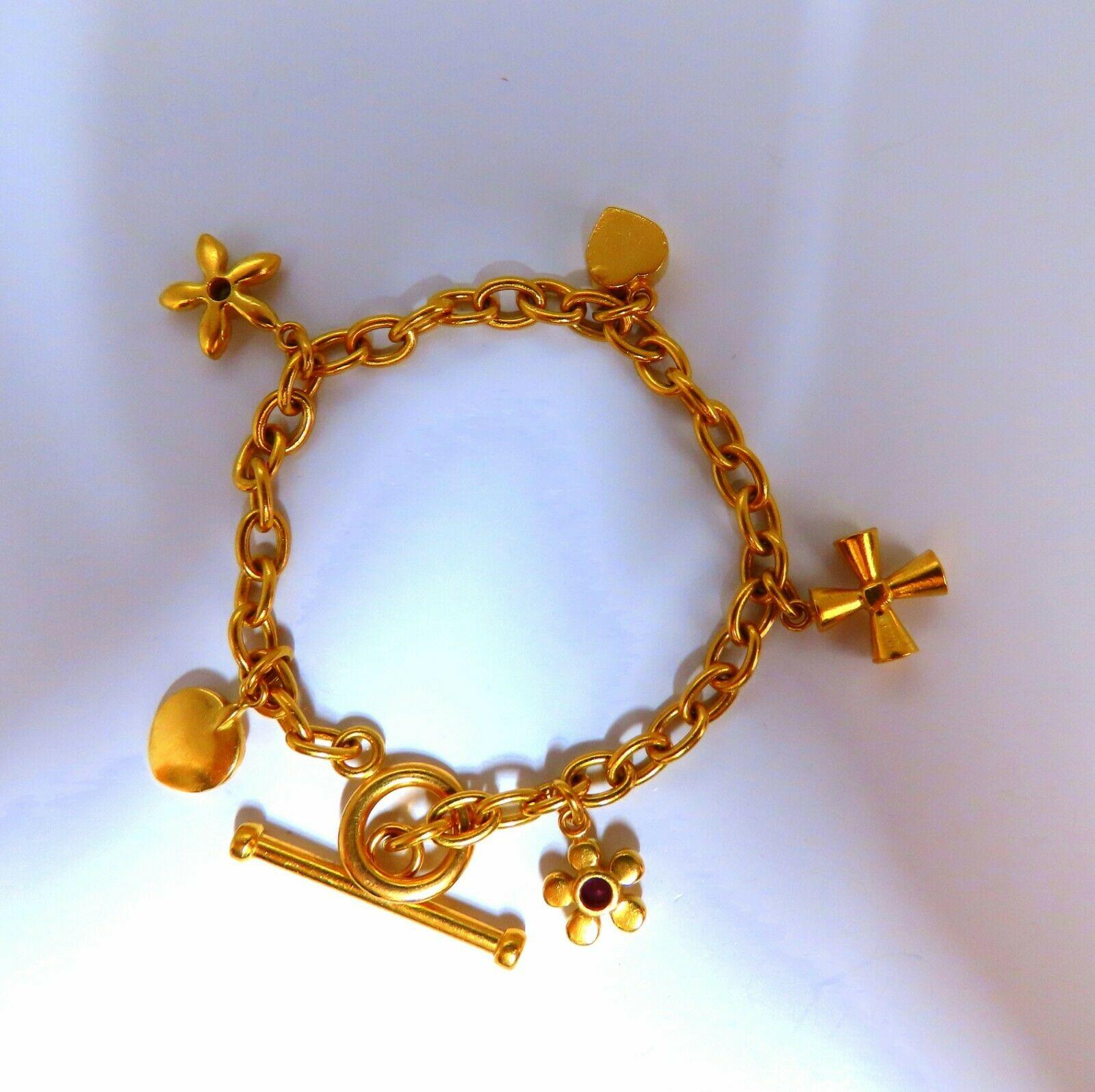 GORGEOUS CHARM BRACELET


5 Statement charms. 

31.5 grams
22kt yellow gold.

7 inches

Gorgeous Matte Satin Finish

5mm wide caliber

.15ct Round Diamonds on Side of Toggle

Safety chain & Pressure clasp.