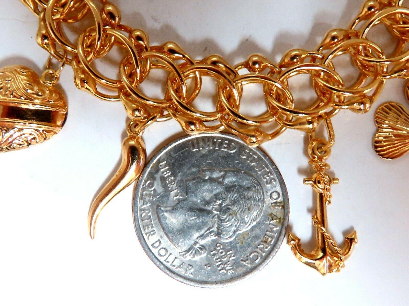 GORGEOUS CHARM BRACELET


10 Statement charms. 

40 grams
14kt yellow gold.

7.5 inches

.50 inch wide caliber

Safety chain & Pressure clasp.
