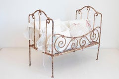 Assortment of Vintage Lace Pillows in 19th Century Metal Crib with Great Patina