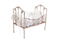 Assortment of Vintage Lace Pillows in 19th Century Metal Crib with Great Patina
