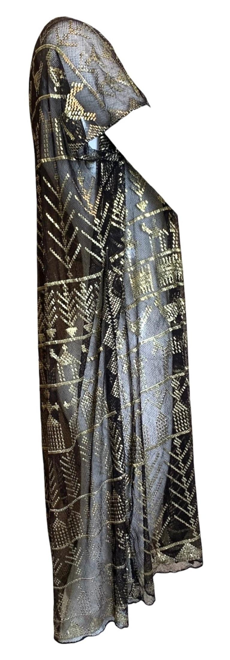 1920s Egyptian Assuit dress. Sheer black cotton mesh dress with hand hammered brass detail.  Assuits became exceedingly popular in the early 20s after the discovery of King Tut's tomb. They were traditionally made as long scarves for a girls dowry