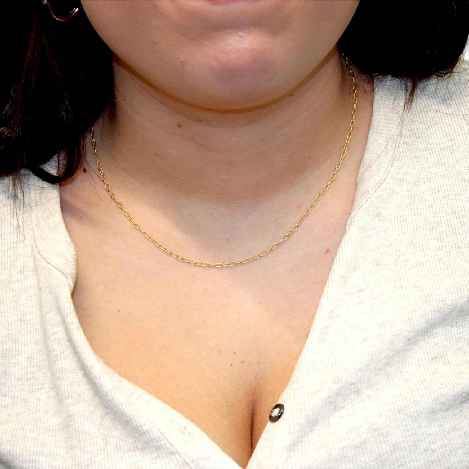 Gracefully refined and rich in texture, the Aster Chain by Mountain Song Jeweler is your go-to piece for timeless elegance. Made in glowing 18k yellow gold, this 18-inch necklace features 2 x 5 mm textured oval links, offering a soft shimmer and
