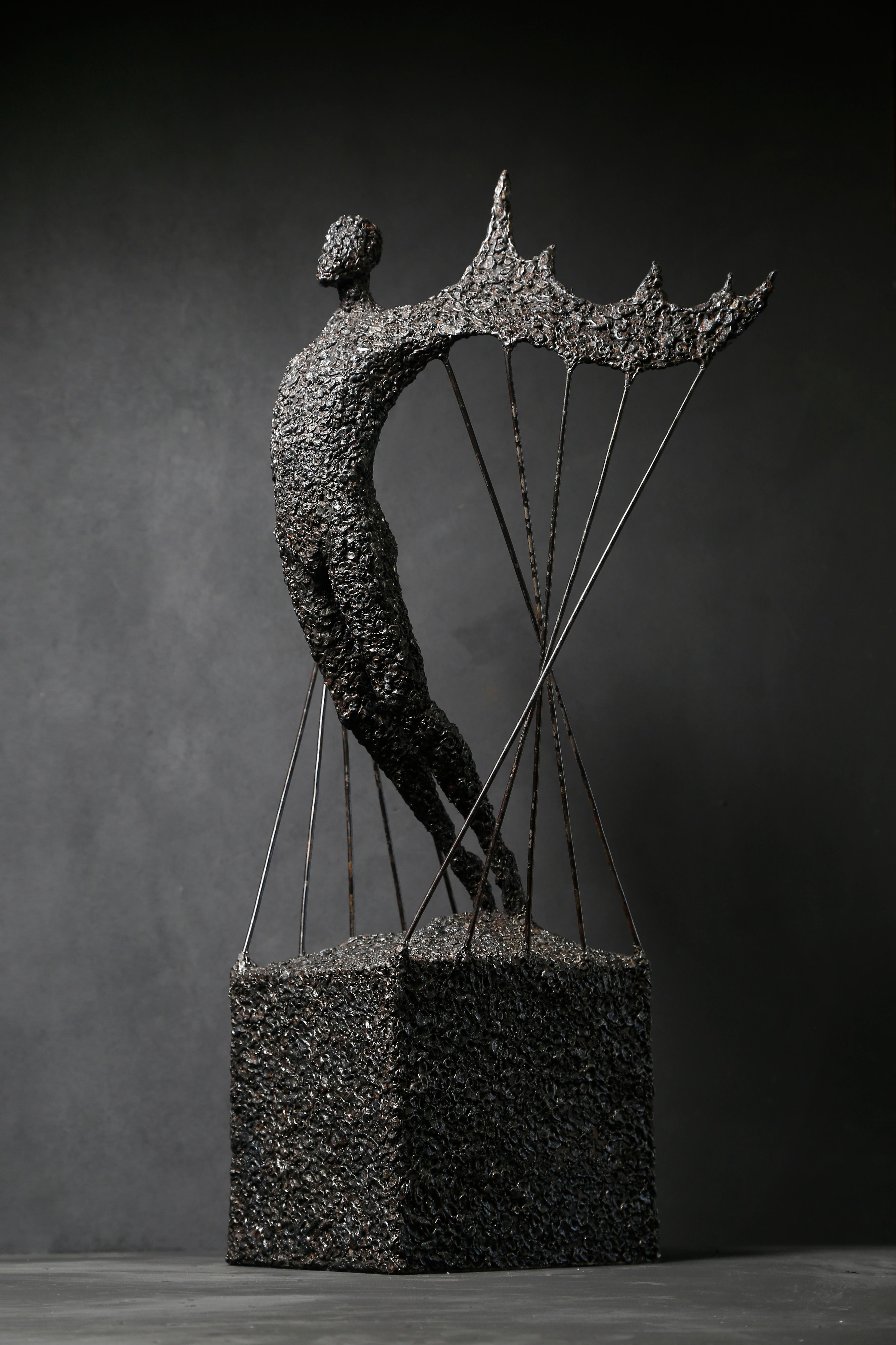 TRANSFORMATION - Black Figurative Sculpture by Astian Rey