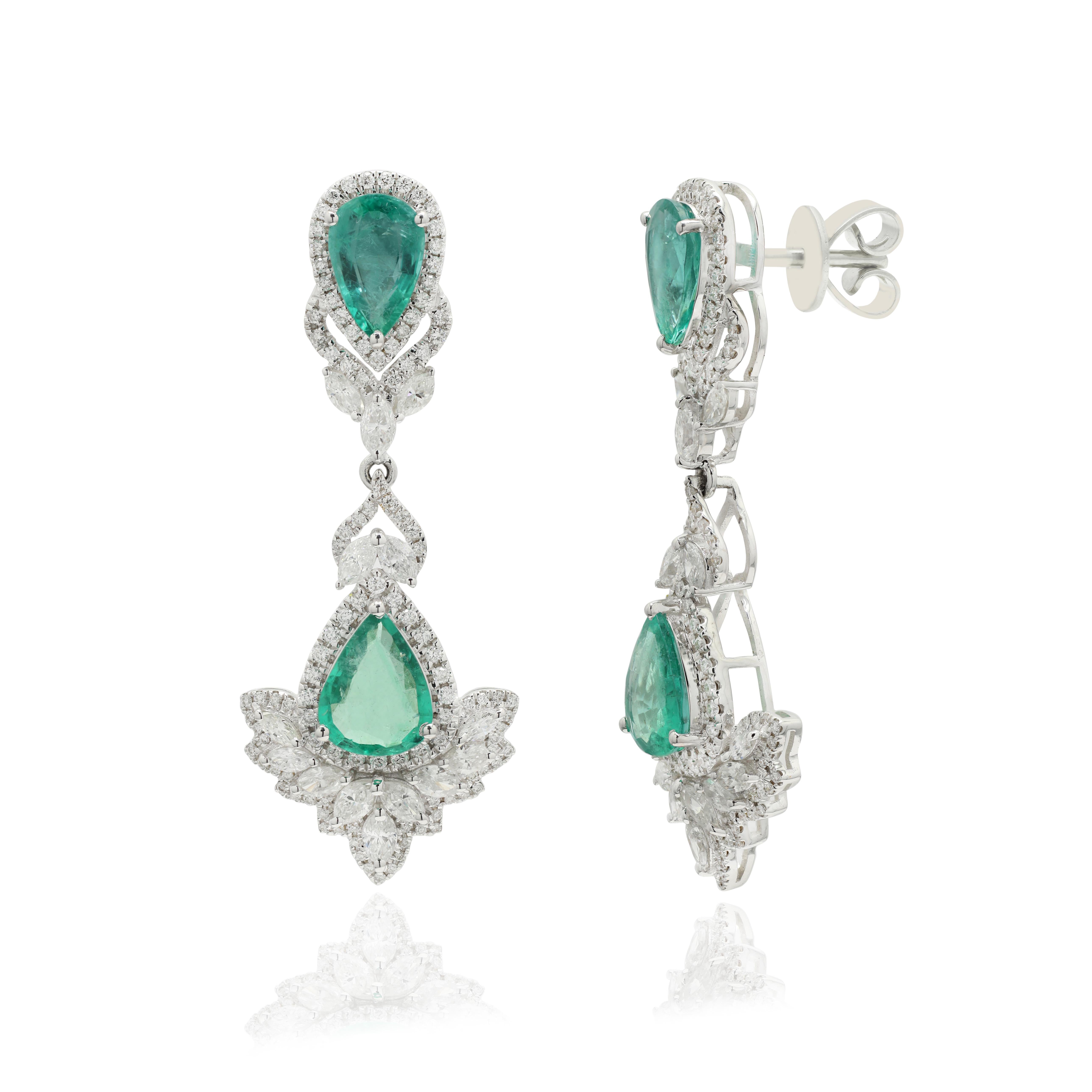 Emerald and Diamond Dangle earrings to make a statement with your look. These earrings create a sparkling, luxurious look featuring pear cut gemstone.
If you love to gravitate towards unique styles, this piece of jewelry is perfect for you.

PRODUCT