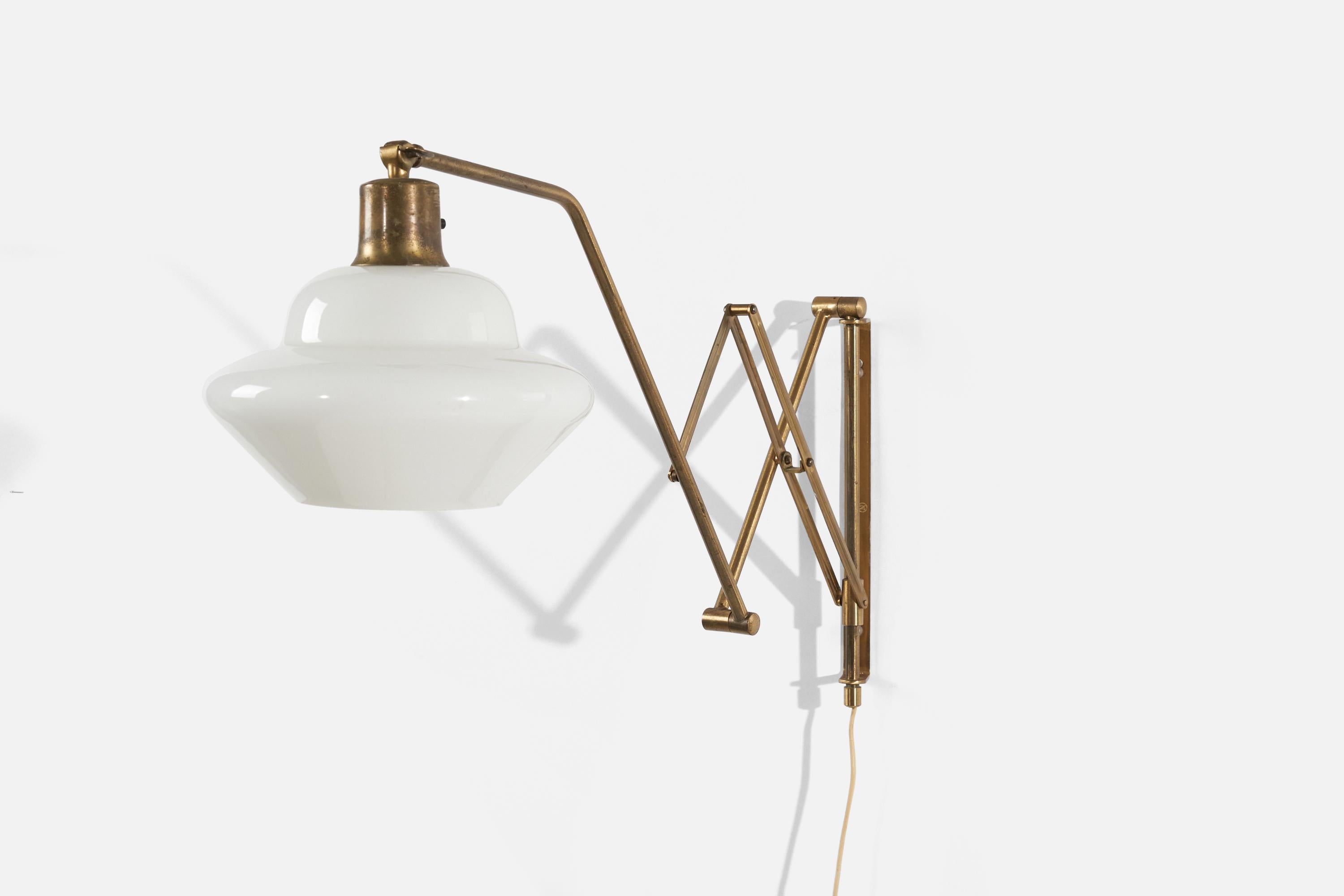 An adjustable, brass and milk glass wall light, designed and produced by Astra, Norway, c. 1950s. 

Dimensions of the back plate (inches) : 10.375 x 0.75 x 0.8125 (H x W x D)
Maximum depth (inches) : 34.25
Minimum depth (inches) : 13.5