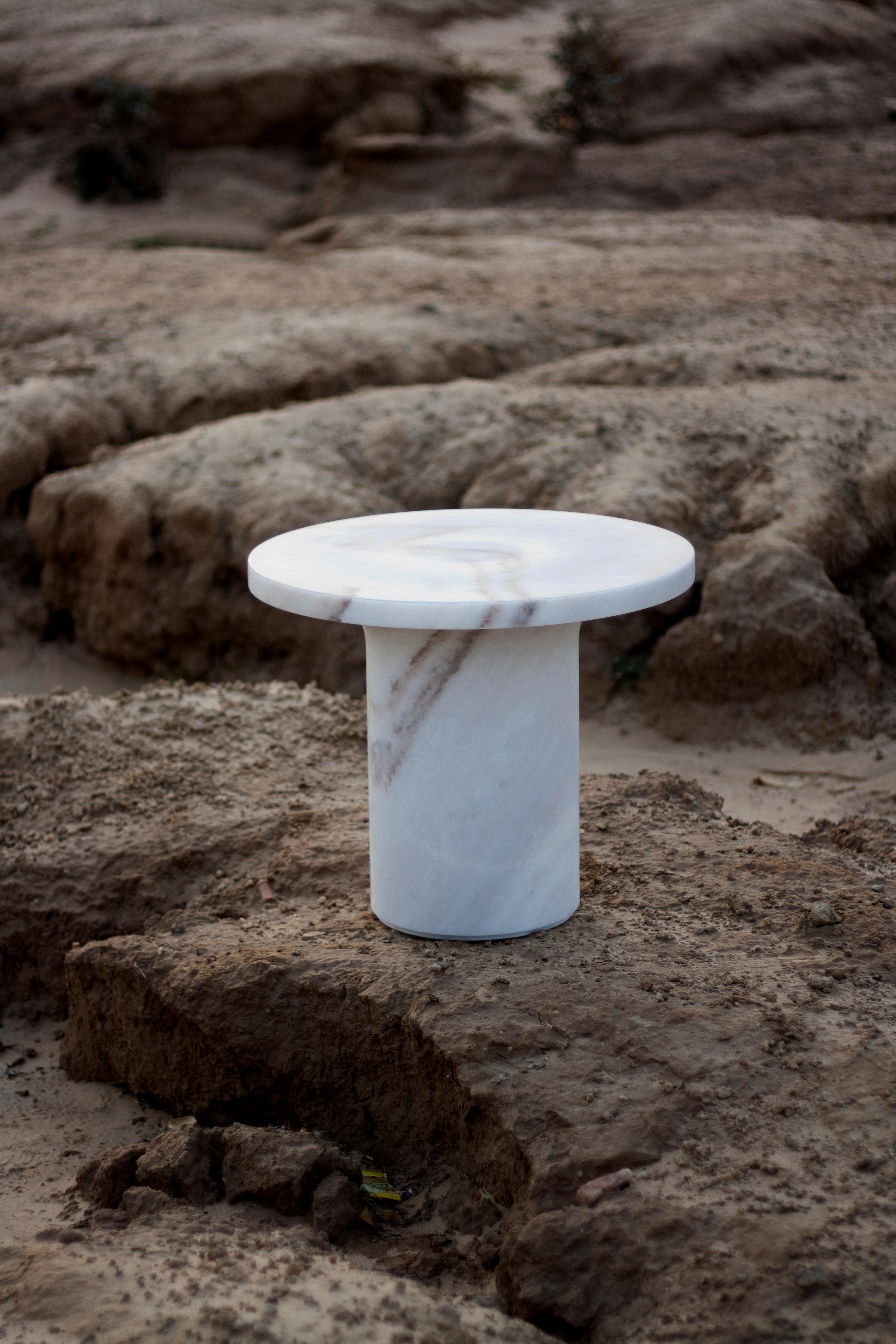 Astra cocktail table in mist white marble by Raw Material 

Is there any better way to enjoy an evening or a cocktail? Anything you rest on the Astra Table will look mesmerizing. Its solid and stately shape is softend by the delicate lines of the