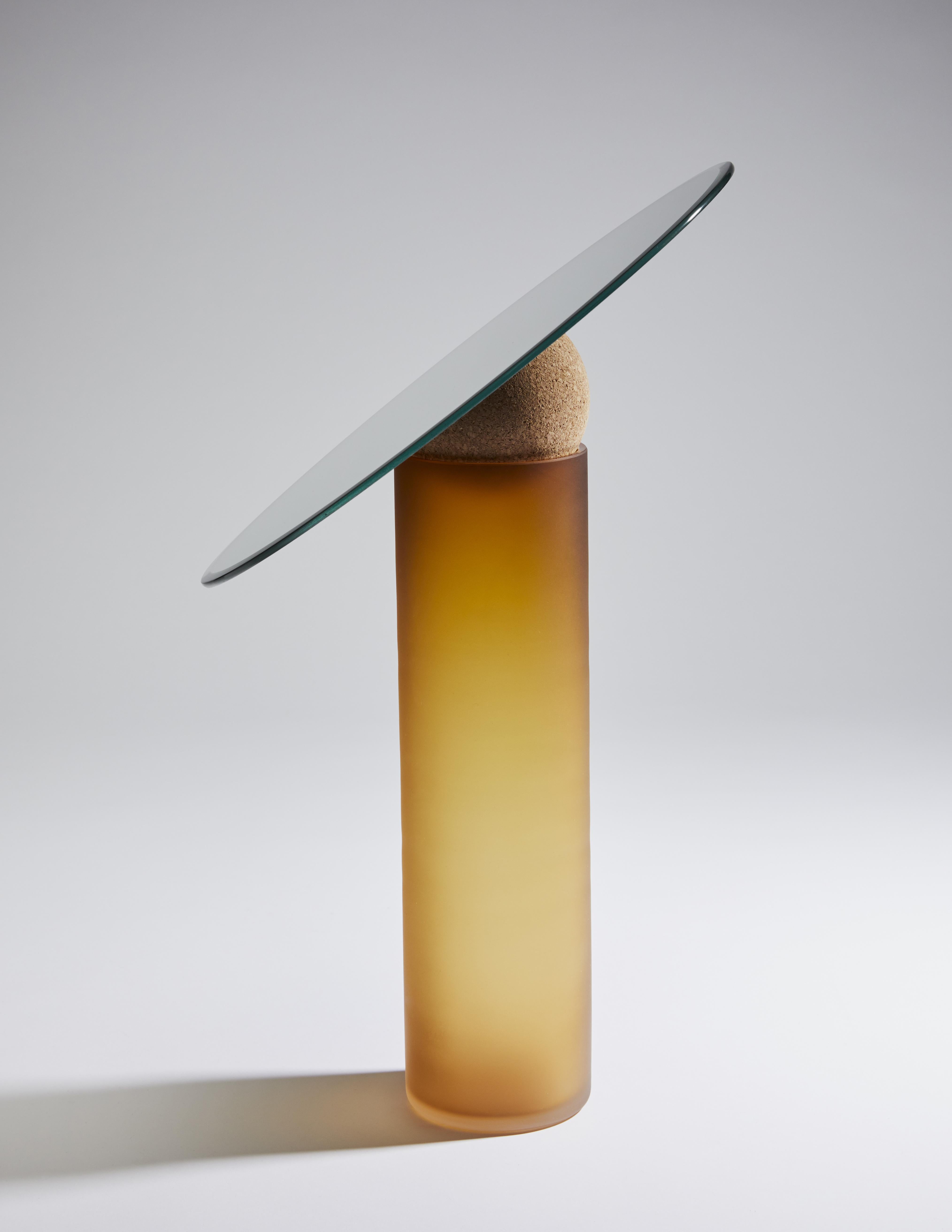 Astra Table Mirror-34 by Clemence Birot
Dimensions: Mirror Ø 34 x 50 cm
Materials: mirror, glass, cork. 
Available in shiny and sandblasted version.

Clemence Birot started her career in Copenhagen, Denmark, and discovered a design practice