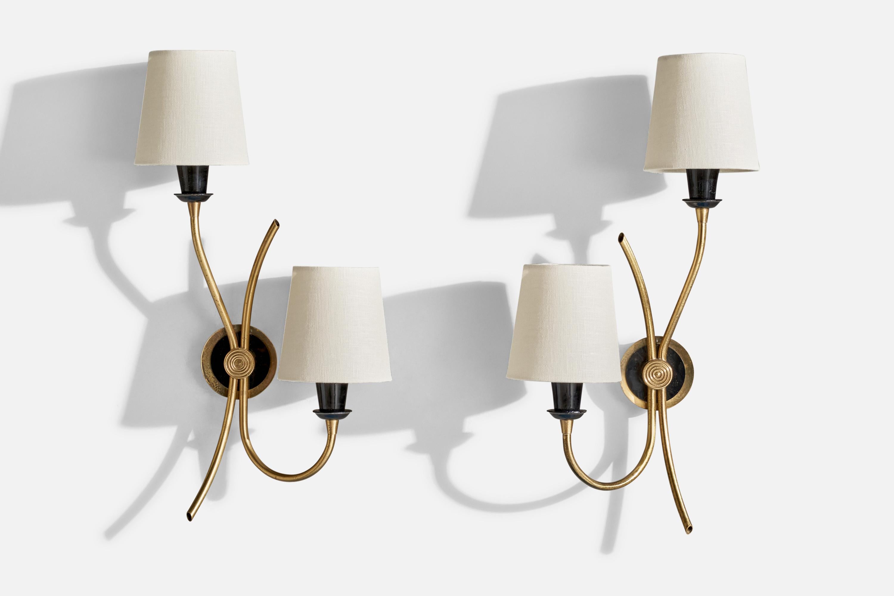 A pair of brass, black-lacquered metal and white fabric wall lights produced by Astra, Norway, c. 1950s.

Overall Dimensions (inches):  17.5” H x  8.5” W x  6“D
Back Plate Dimensions (Inches):  2.5” H x 2.5” W x 1” D
Bulb Specifications: E-14