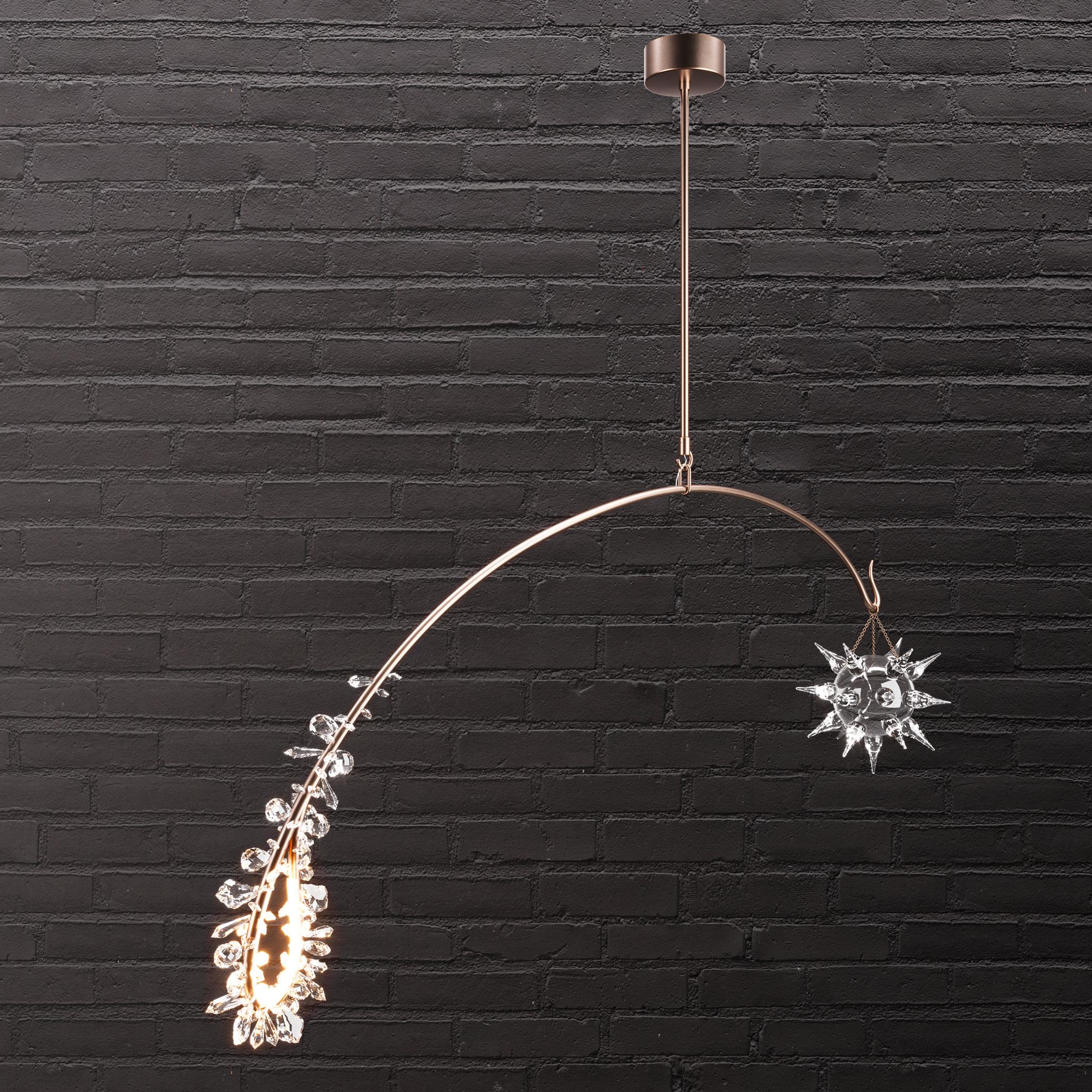 A study in equilibrium - a spiked starburst of handblown Murano glass hovers opposite a cluster of Austrian crystal facets - balanced on a solid brass arm.

Models in the collection are individually hand-crafted by the skilled artisans in our