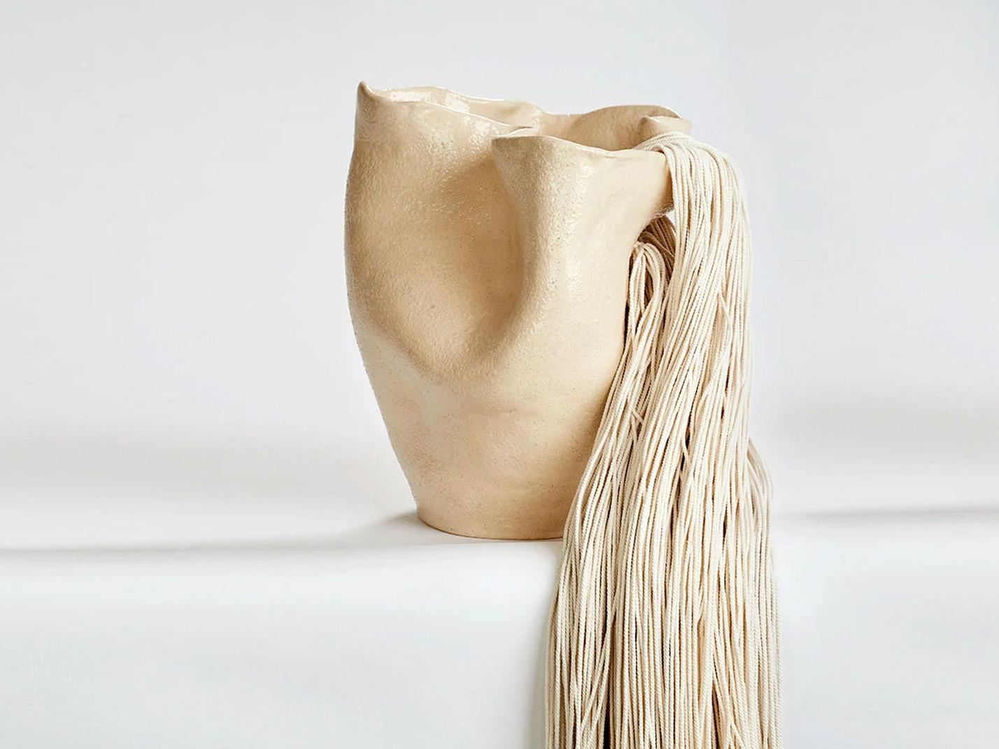 ASTREA, 2023 by Magda von Hanau
From the Visceral series
Clay, glass glaze & wool strings. 
Dimensions: 37 cm H x 37 cm W 
Weight 20lbs

The Visceral series delves into the intricate relationship between the mind and the body, specifically focusing
