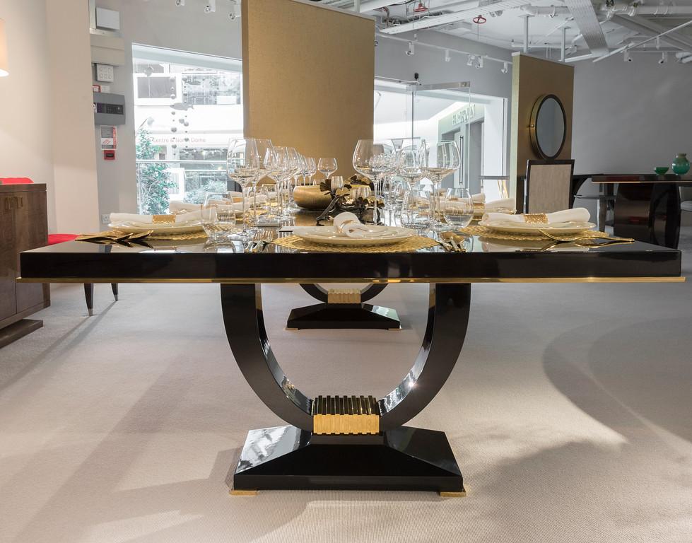 A popular dining table finished in sycamore black with polished nickel detailing.

This timeless beauty is the number one choice for a luxury dining room, exuding sophisticated Art Deco style and elegance.

Metalwork can be changed to polished brass