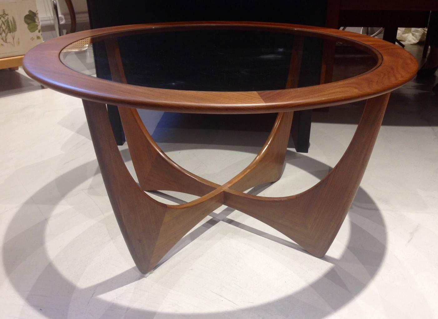Round stained teak and glass coffee table named 