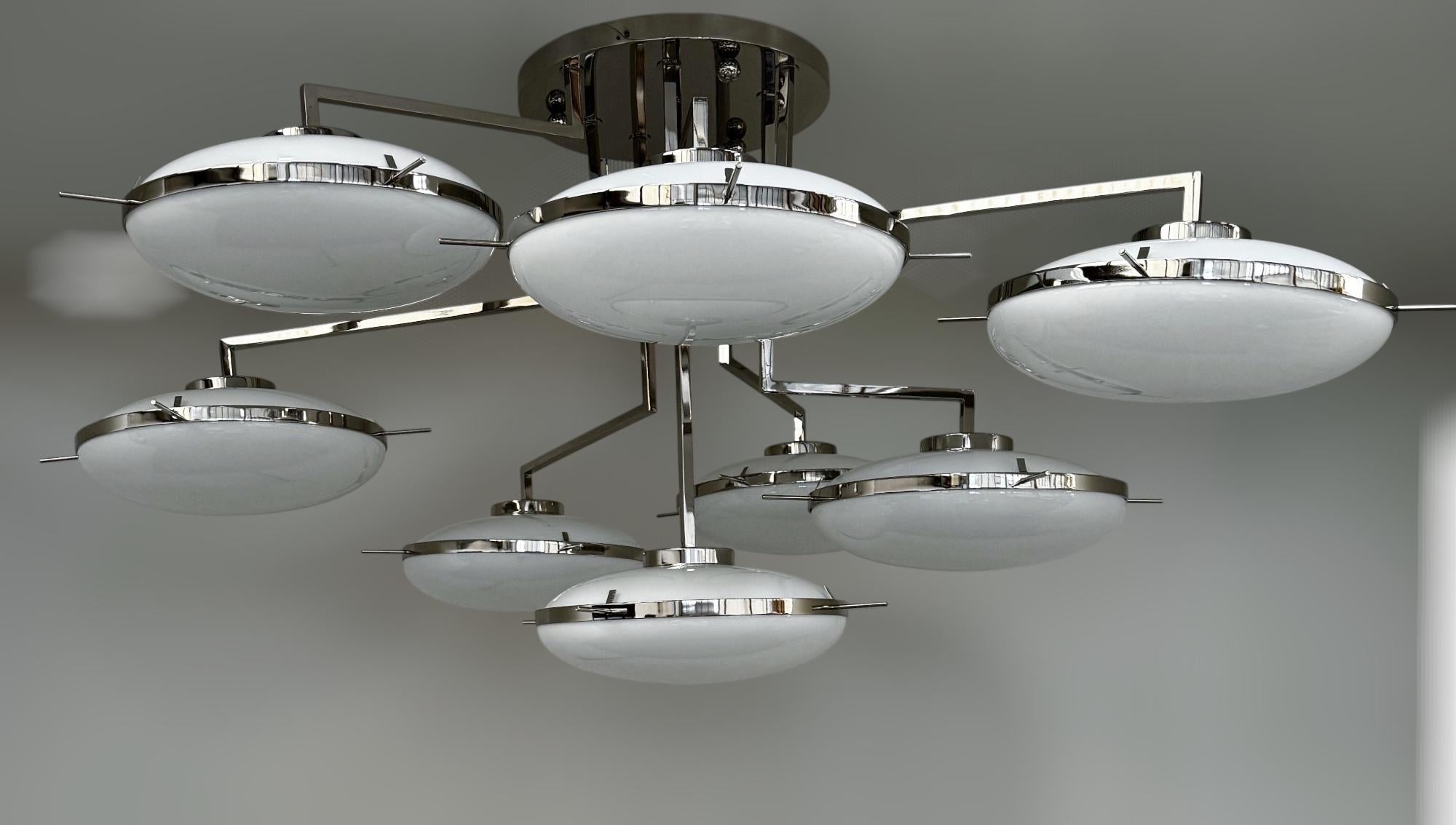 Italian flush mount with 8 glossy white Murano glass shades mounted on polished nickel finish structure / Made in Italy
8 lights / E12 or E14 type / max 40W each
Length: 72 inches / width: 60 inches / height: 30 inches
Order only / This item ships