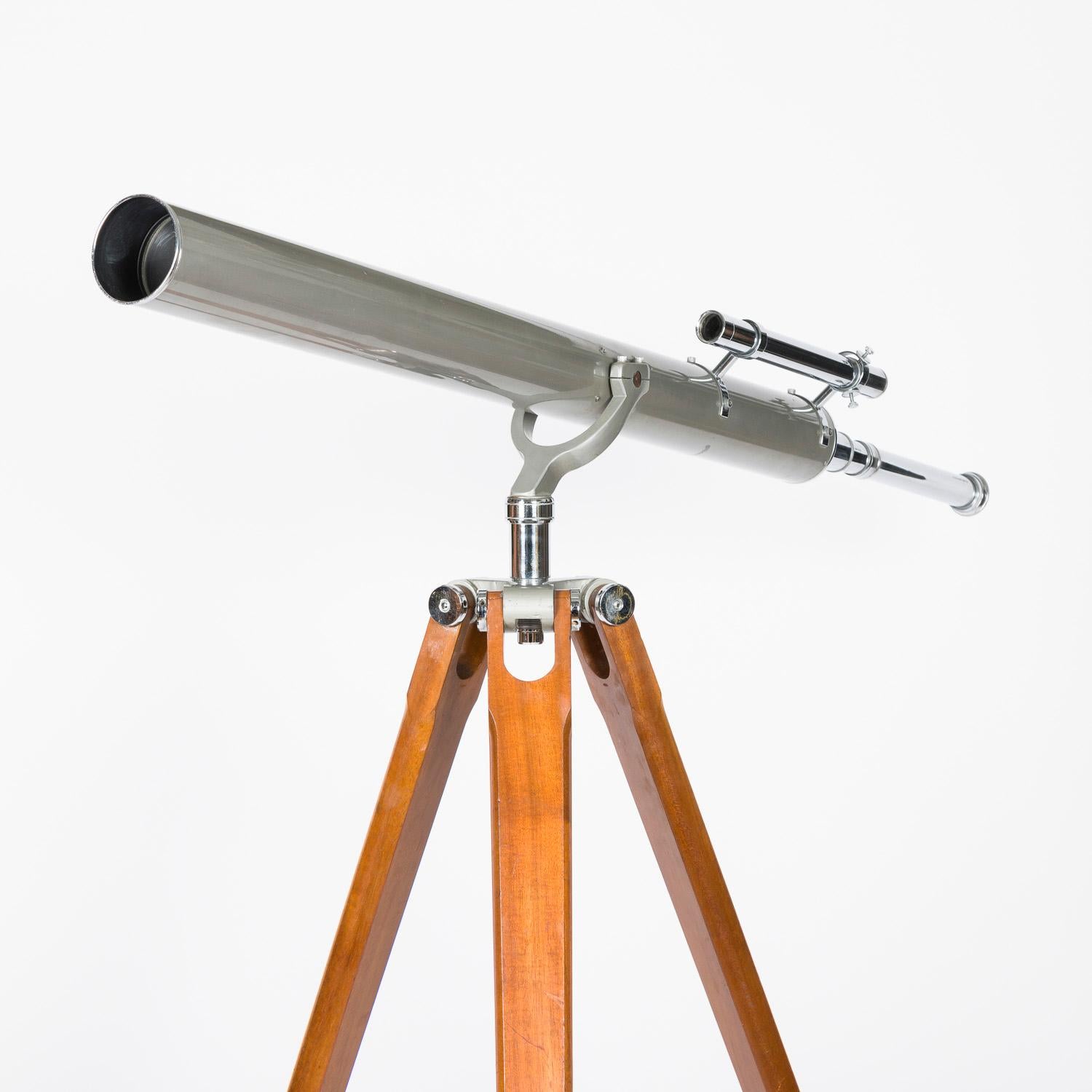 A mid 20th century tripod mounted 