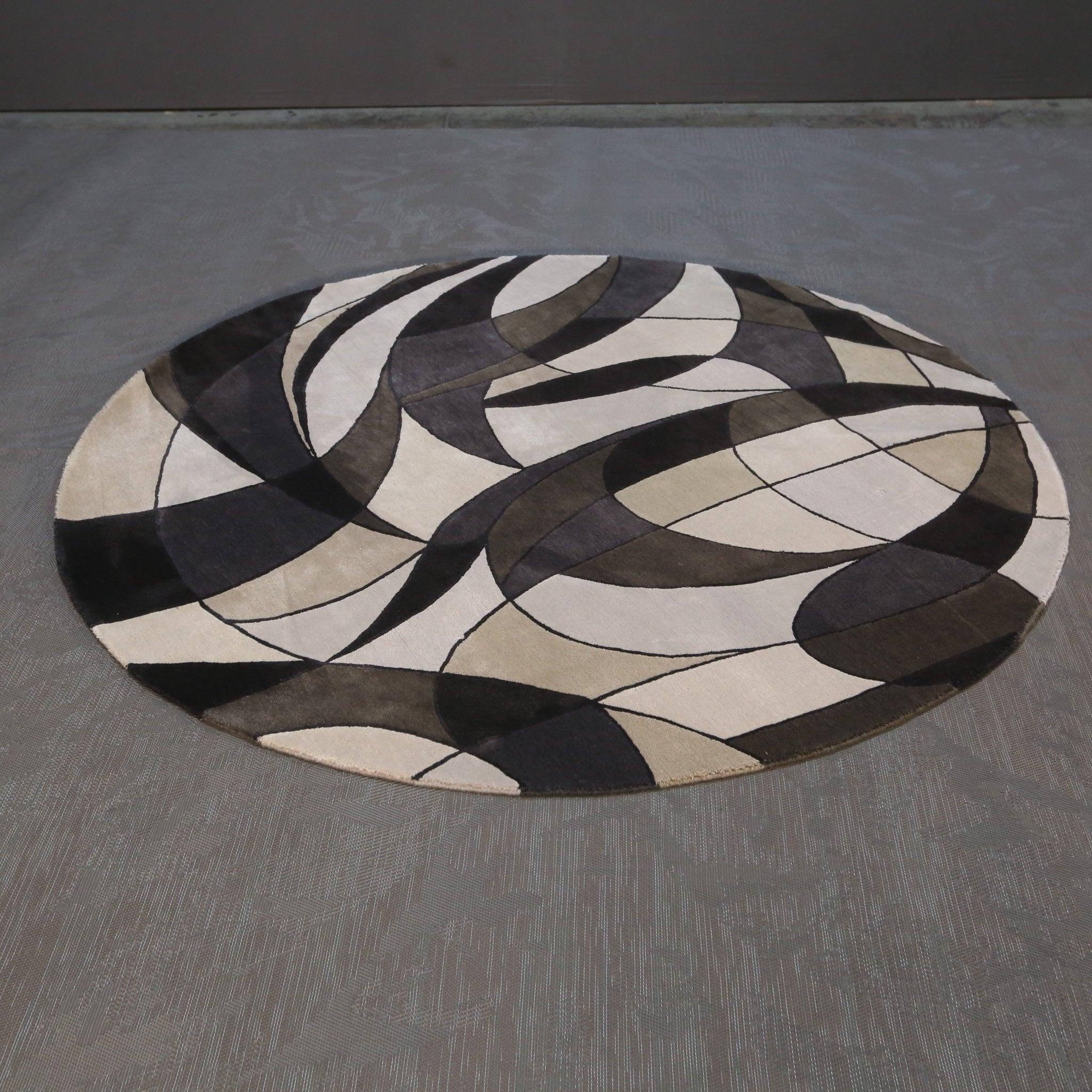 Introducing the stunning Asymetrie Rug by renowned designer Christopher Guy. This luxurious rug boasts a unique asymmetrical design, adding a touch of modern elegance to any space. Handcrafted with the finest materials, this rug features a soft and