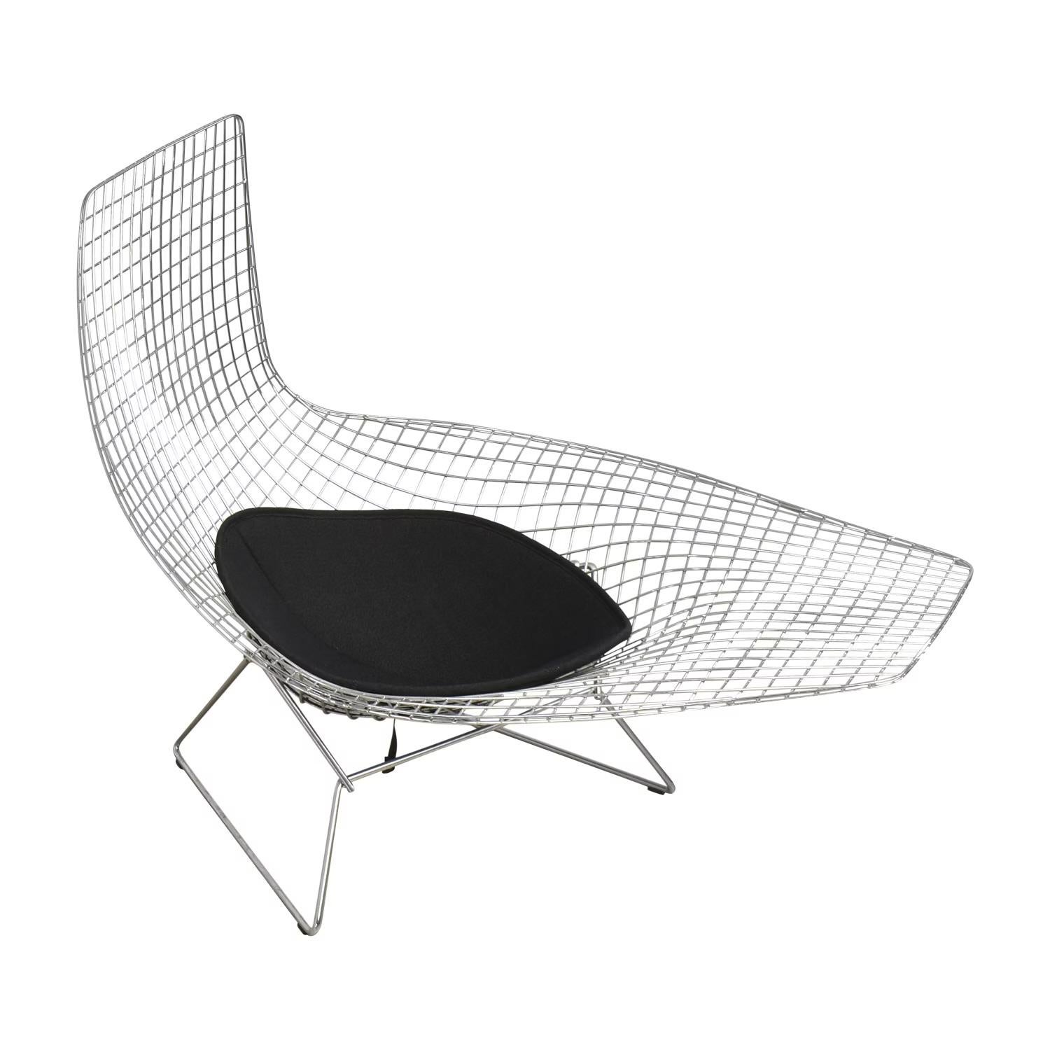 Design Harry Bertoia, 1953
Welded steel rods
Black textile cushion.
Made in USA by Knoll

Harry Bertoia's 1950 experiment with bending metal rods into practical art produced a revered collection of seating, including this previously unreleased