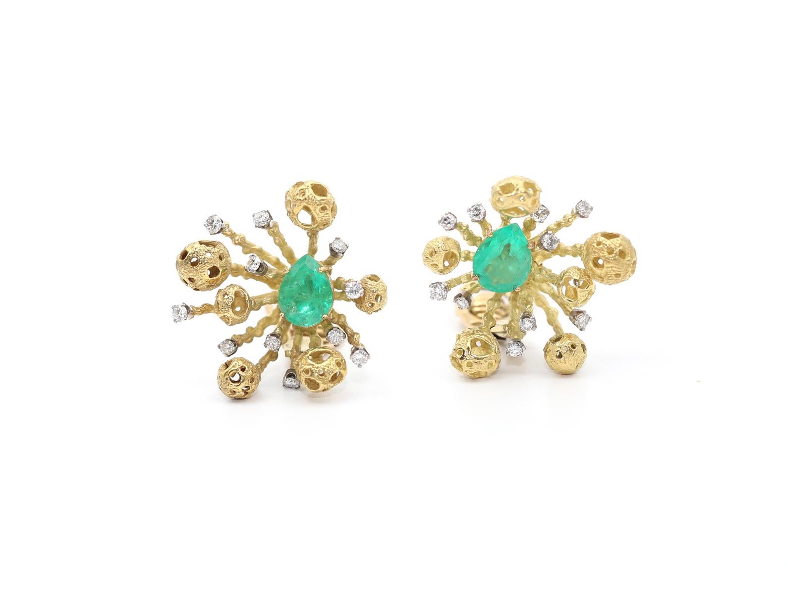 6 Carats of Colombian Emeralds and Diamonds. With retro lever back stud earrings. It was created around 1970. 

Pear-shaped Emeralds are set in the middle of the composition, while Yellow Gold “beams” with asteroid shapes as if blown away from the