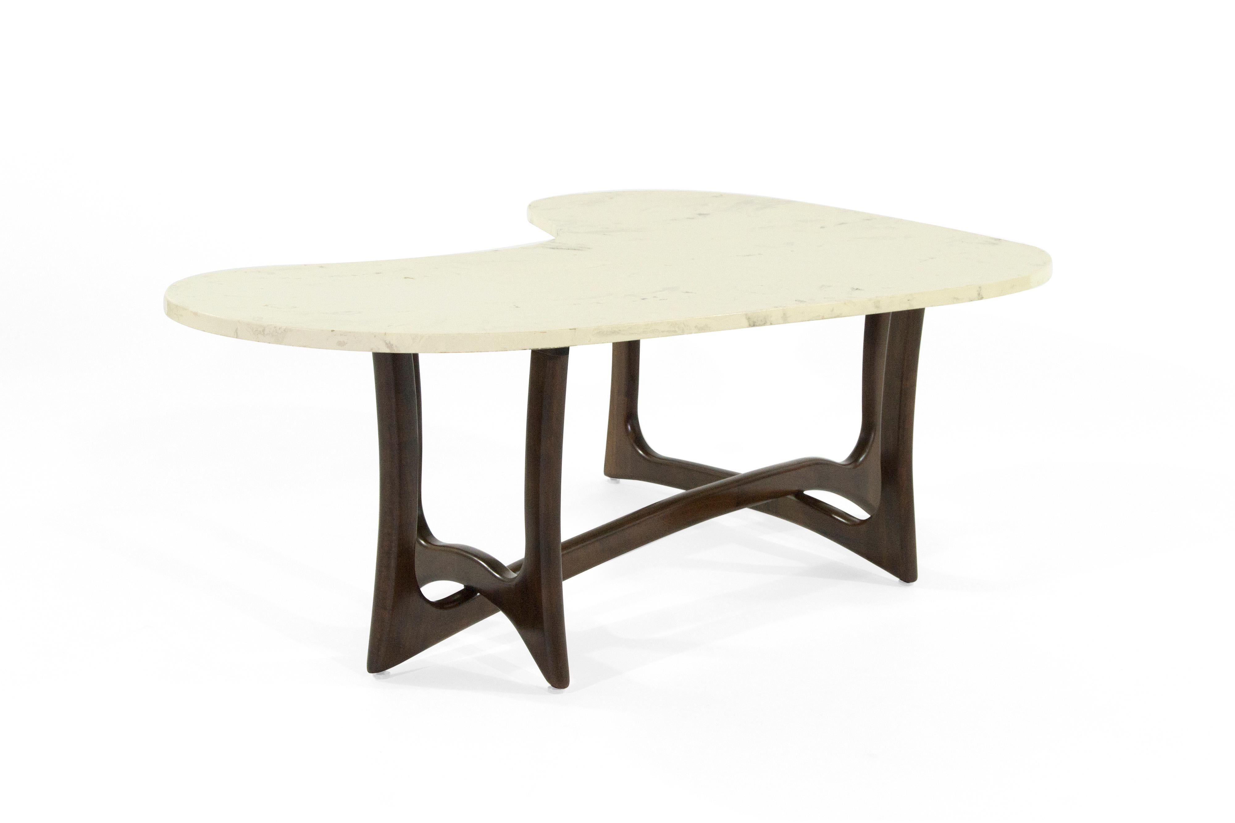 An extremely rare coffee table designed by Adrian Pearsall, circa 1950s. Features a newly polished biomorphic shaped off-white marble top and a fully restored sculptural walnut base.