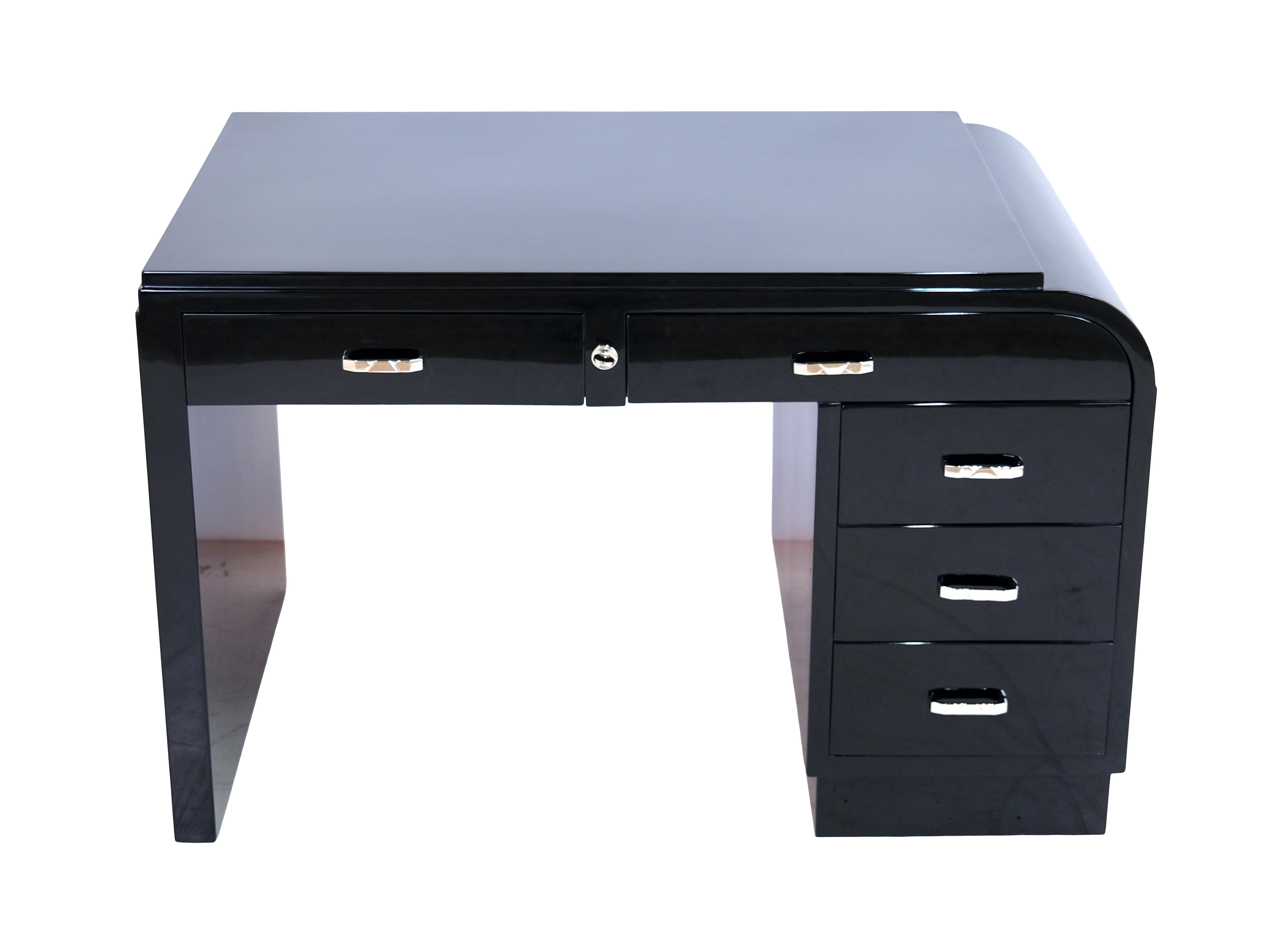 Desk
Piano lacquer, black high gloss
Special feature: the lock sits in the body, not in the drawers as usual.

Original Art Deco, France, 1930s.

Dimensions:
Width: 120 cm
Height: 77 cm
Depth: 66 cm