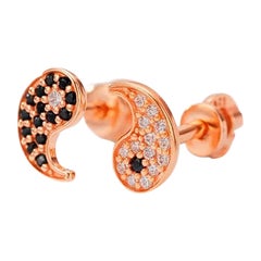 Asymmetric Yin Yang Earrings studs in 14k gold.