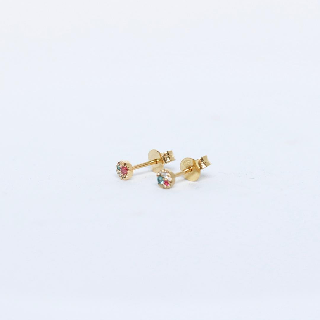 Handcrafted in Belgium by jewellery artist Joke Quick, these tiny 4 mm stud earrings in 18K yellow gold are a playful yet sophisticated expression of contemporary craftsmanship.

Designed as a subtly mismatched pair, each earring features its own