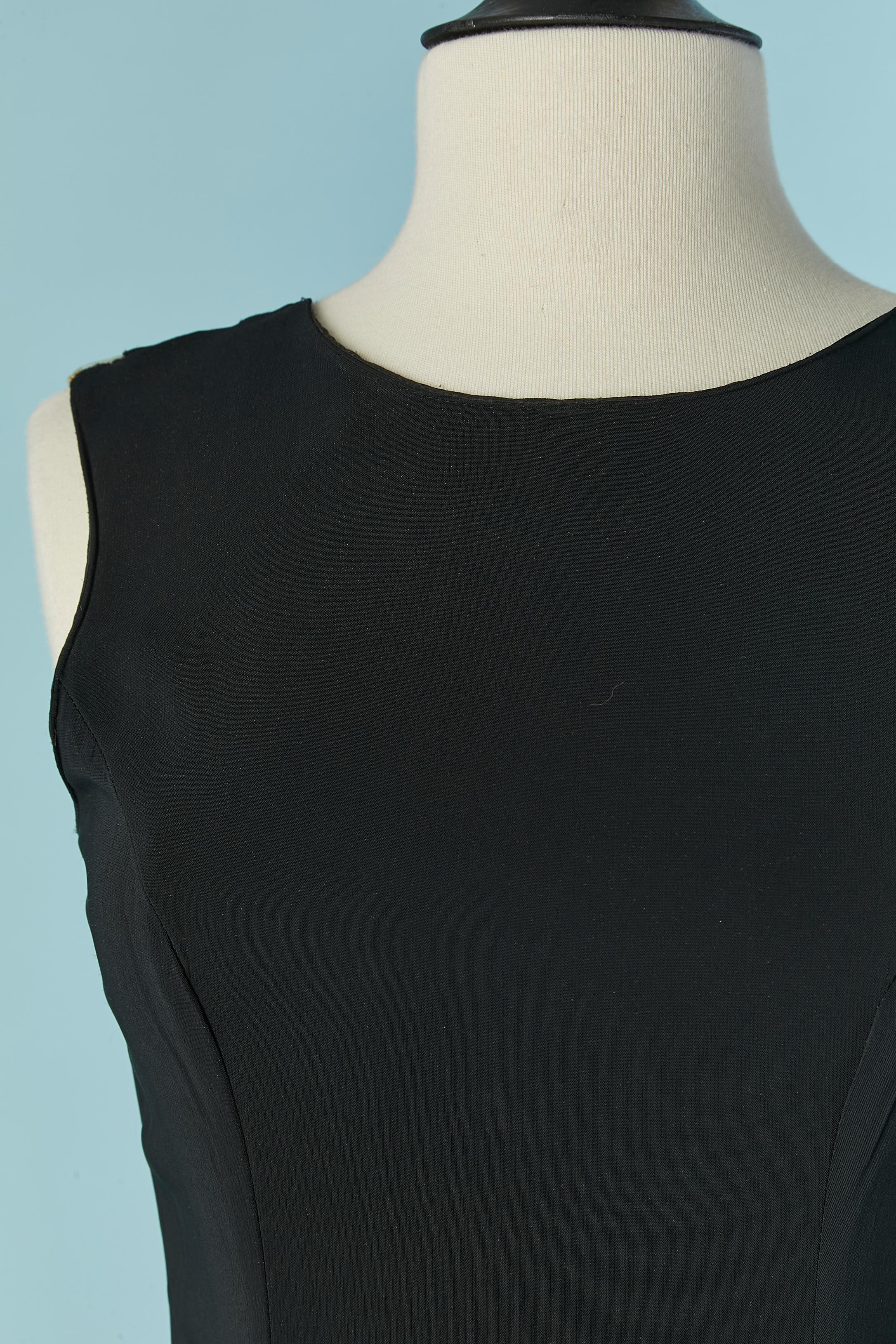 Asymmetrical black evening dress with cut work and tulle inset. Fabric composition: 96% rayon, 4% elasthan. No information regarding the tulle but probably polyester. 
Invisible zip on the left side. Split on the front. 
Lenght middle front =