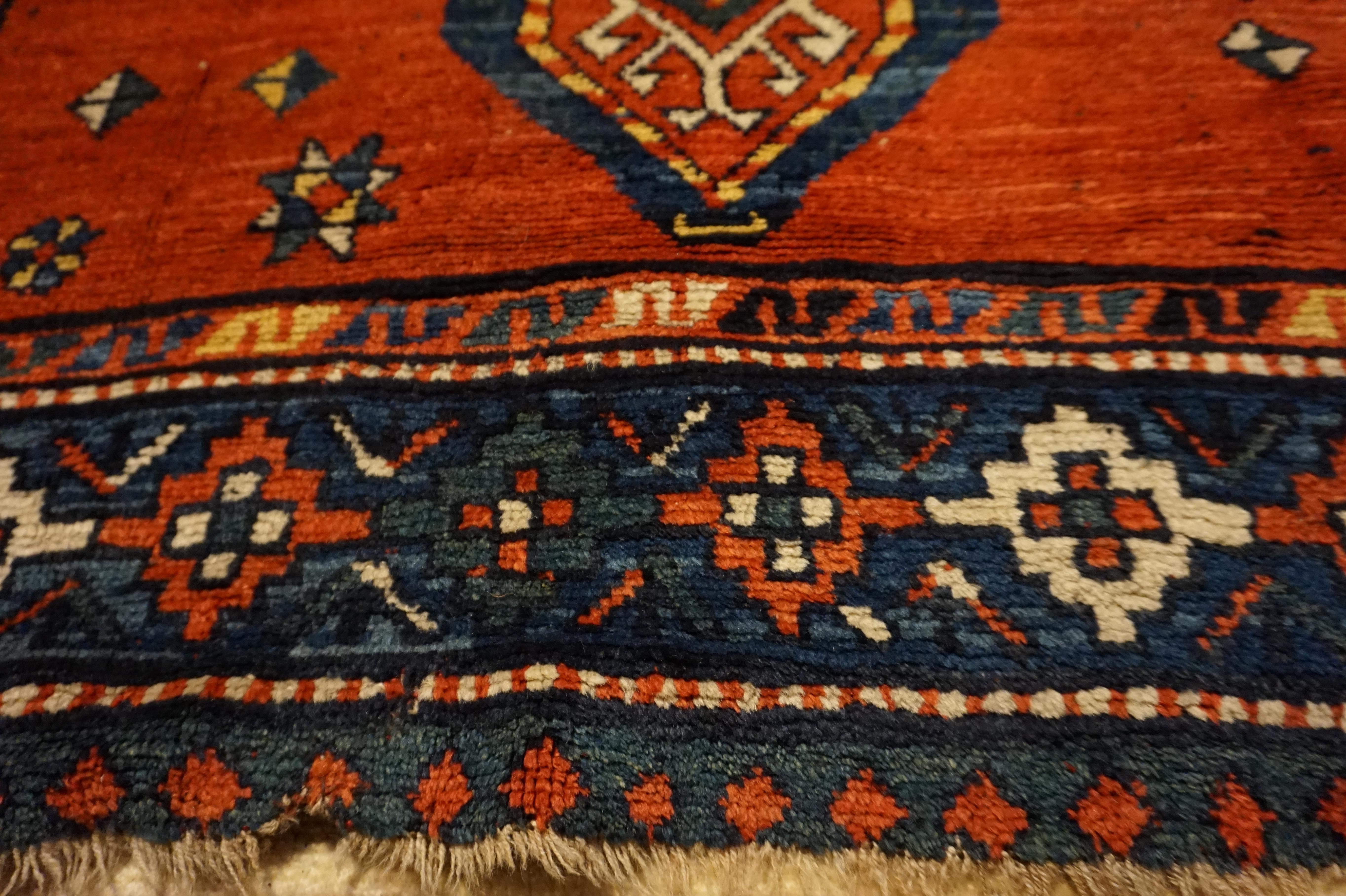 Caucasian Asymmetrical Caucasus Tribal Village Rug with Kite Medallions & Star Motif For Sale