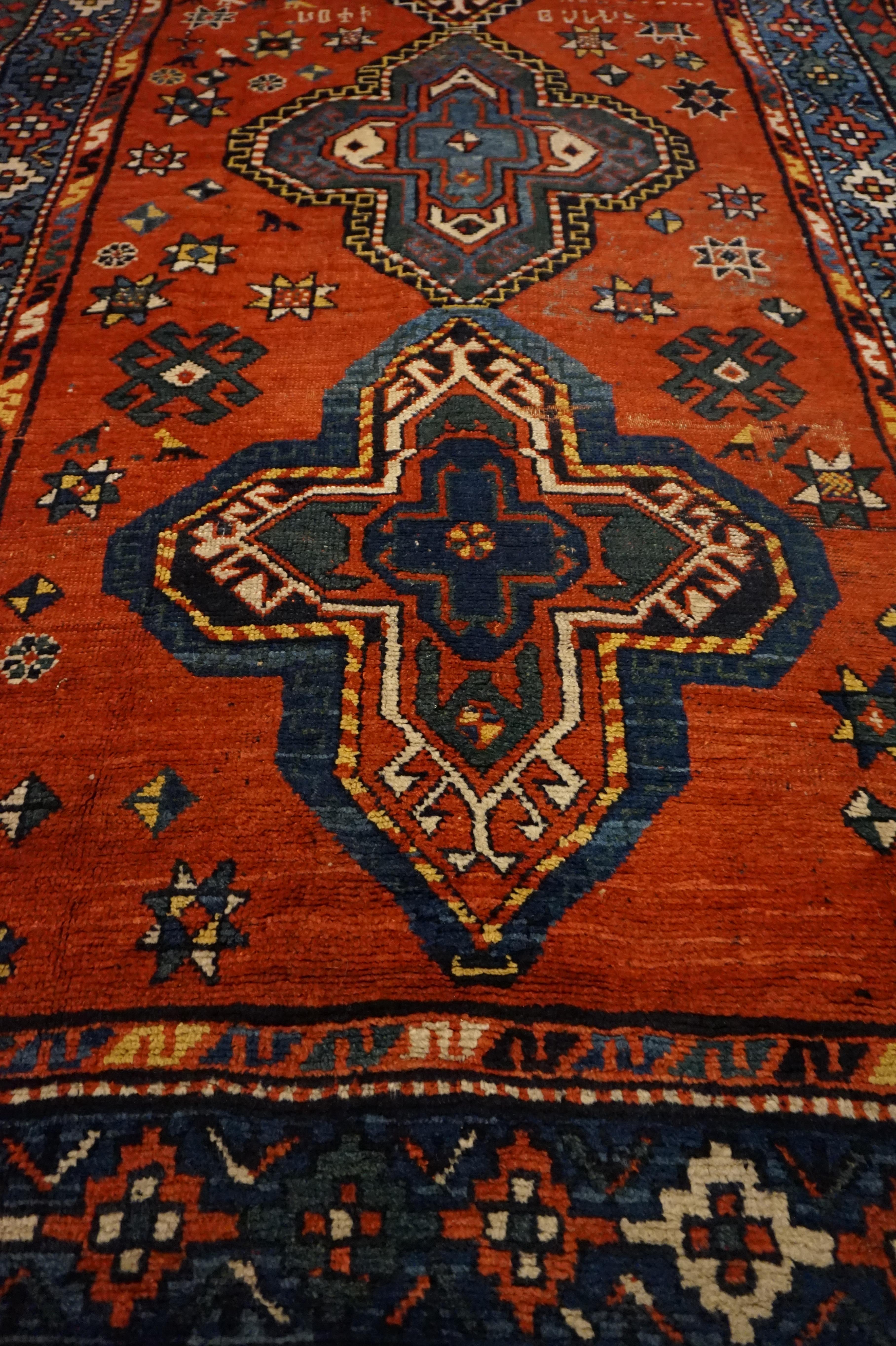 Hand-Knotted Asymmetrical Caucasus Tribal Village Rug with Kite Medallions & Star Motif For Sale