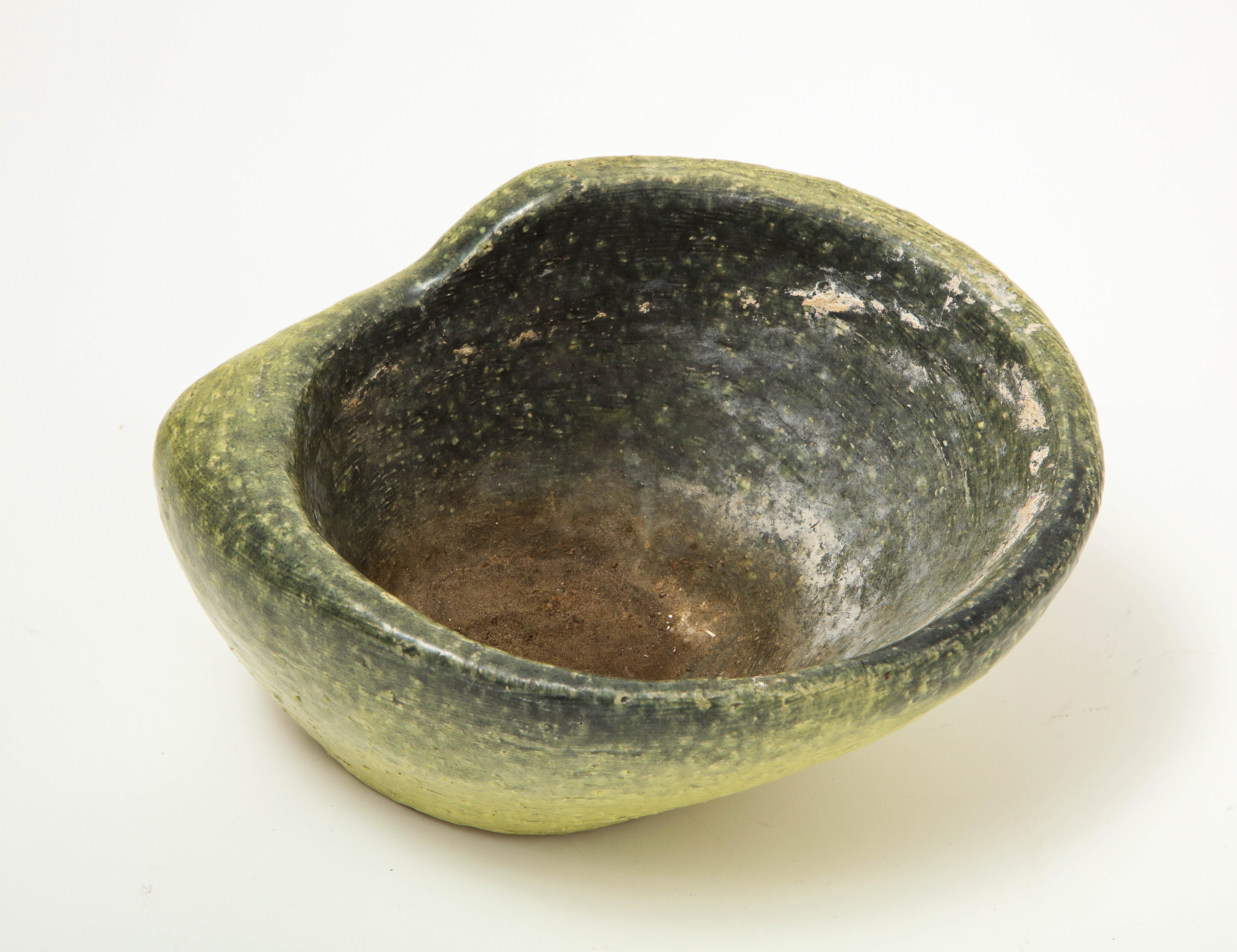 Asymmetrical serving ceramic bowl in ombre green speckled glaze, USA, mid-20th century.