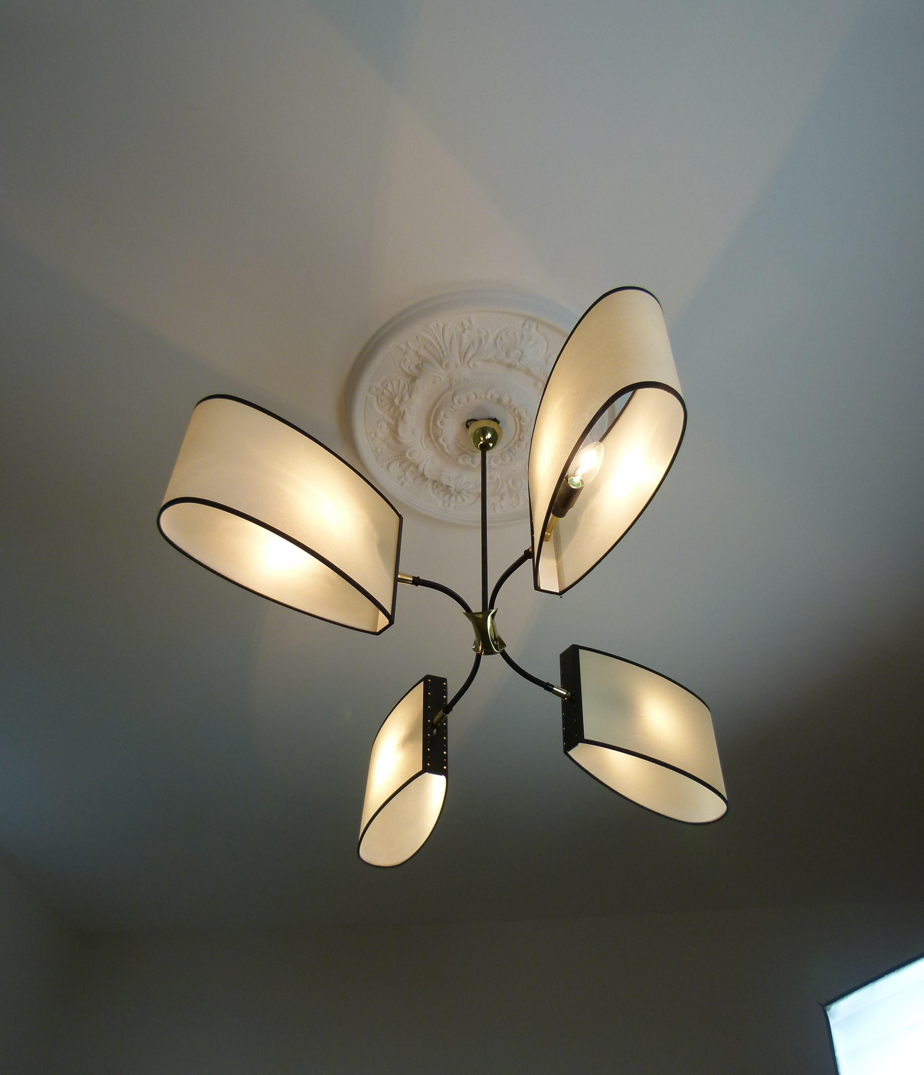 Asymmetrical chandelier with four lighted arms by Maison Lunel, circa 1950