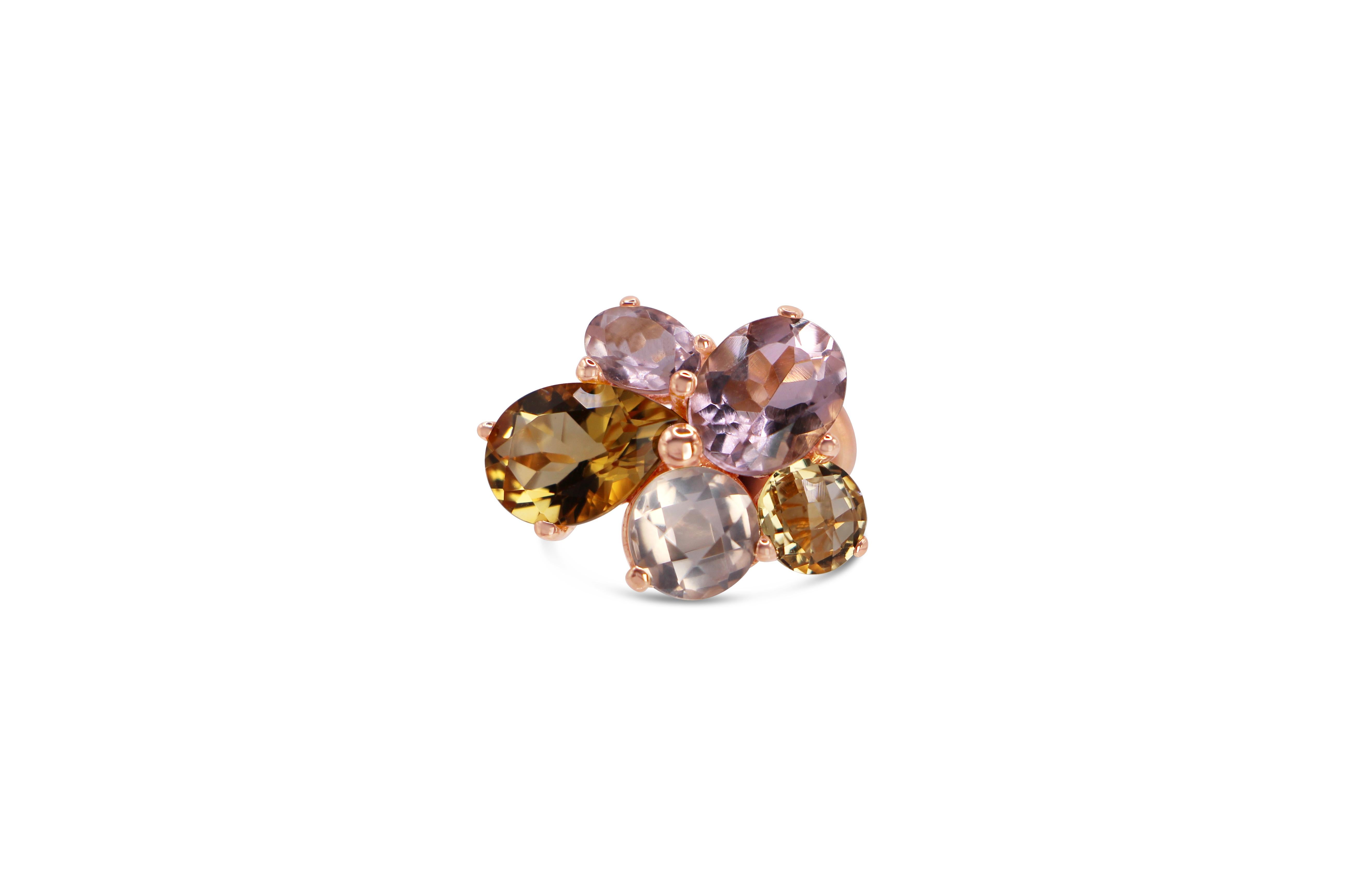 Asymmetrical Cluster floral Ring with Yellow Citrine and Rose Quartz made in 18 Kt Rose Gold
The stones are 10,00 ct mix citrine and rose quartz set as a flower in prong setting. A  handcrafted, one of o kind ring, in 18Kt rose gold.
A statement