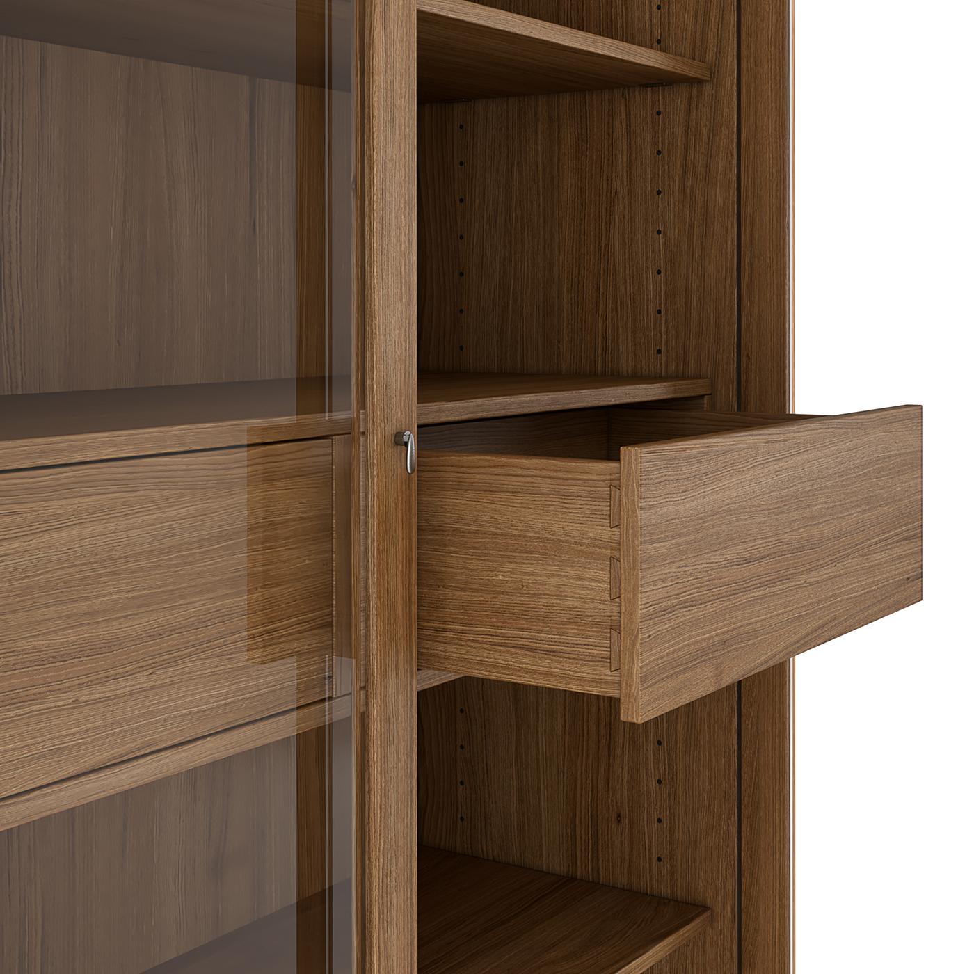Characterized by simple and clean lines, this modern bookcase will elegantly showcase precious books and collectibles. The frame is masterfully handcrafted of white oak and rests on a plinth base with concealed leveling feet. The asymmetrical,