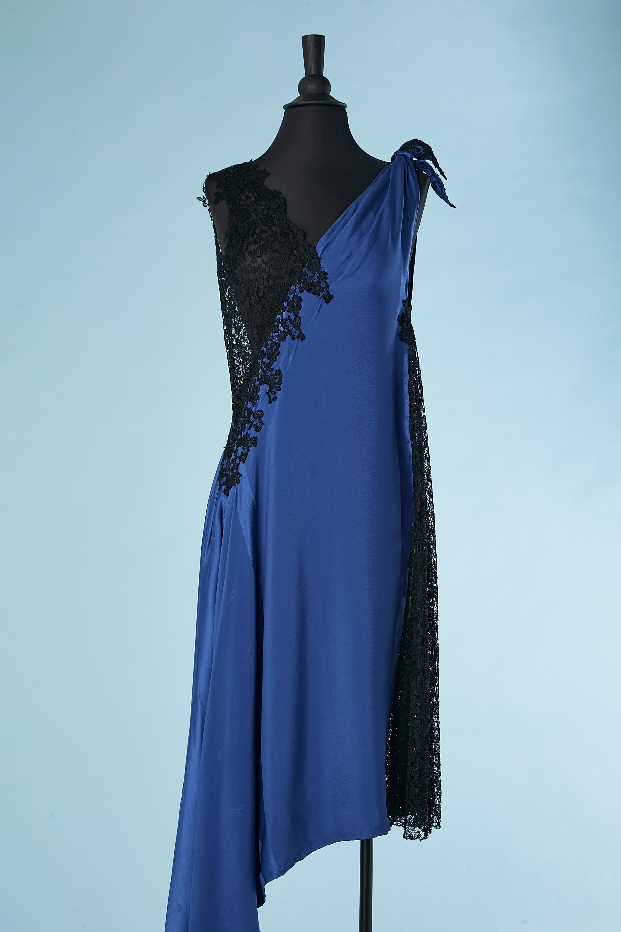 Asymmetrical evening dress in see-through black lace and blue silk jacquard. 
Tiny abstract pattern inside the silk. Bow on the left.See-through lace on the left side 
Short side lenght: 110 cm
Long side lenght: 170 cm
SIZE M 